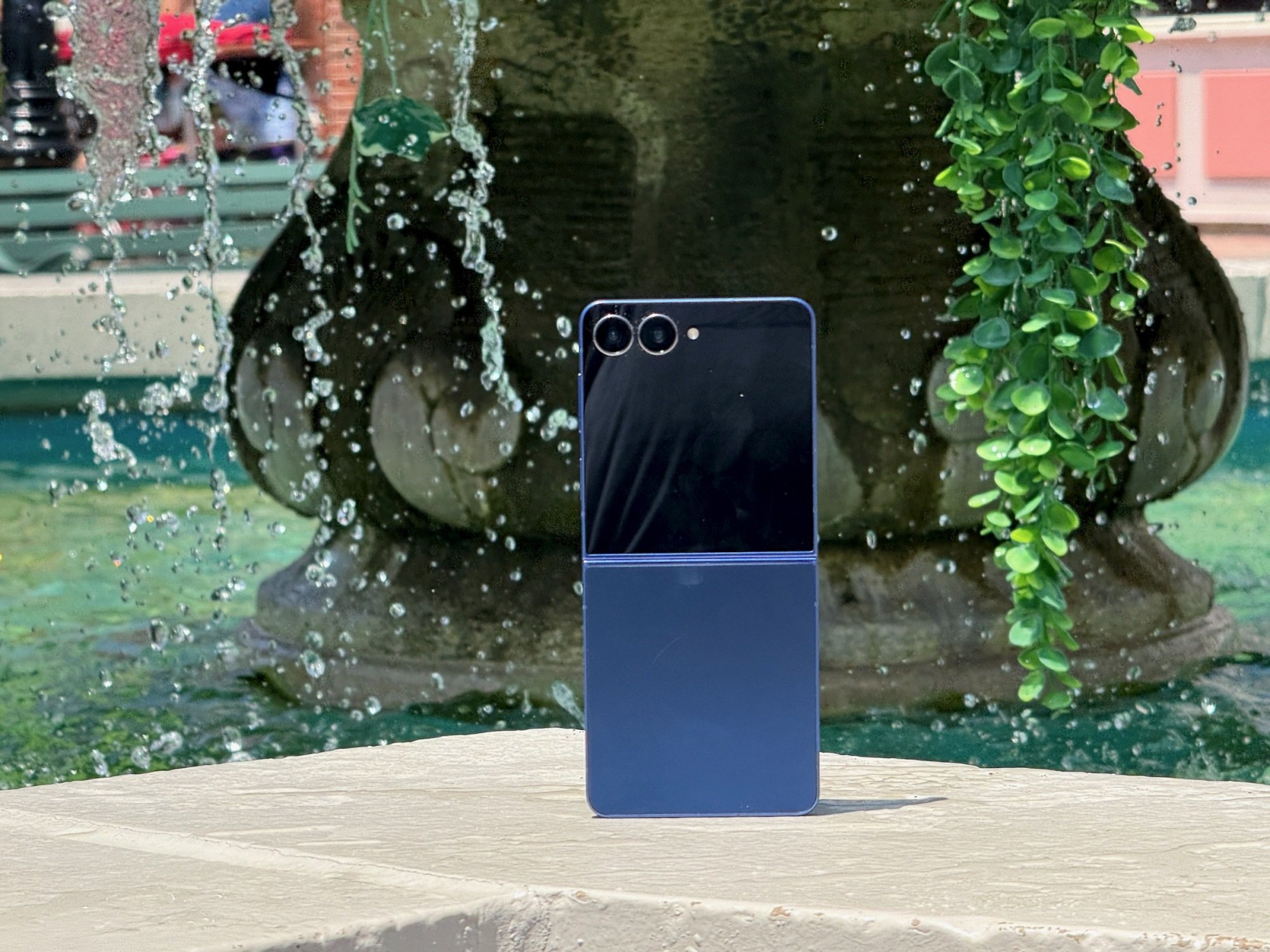 galaxy 7 fold 7 propped up on a fountain