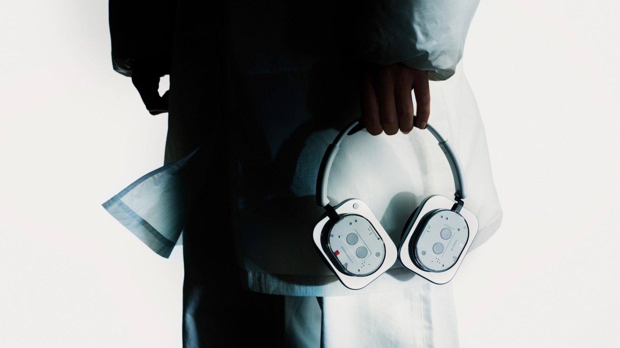 model holding new nothing headphone 1