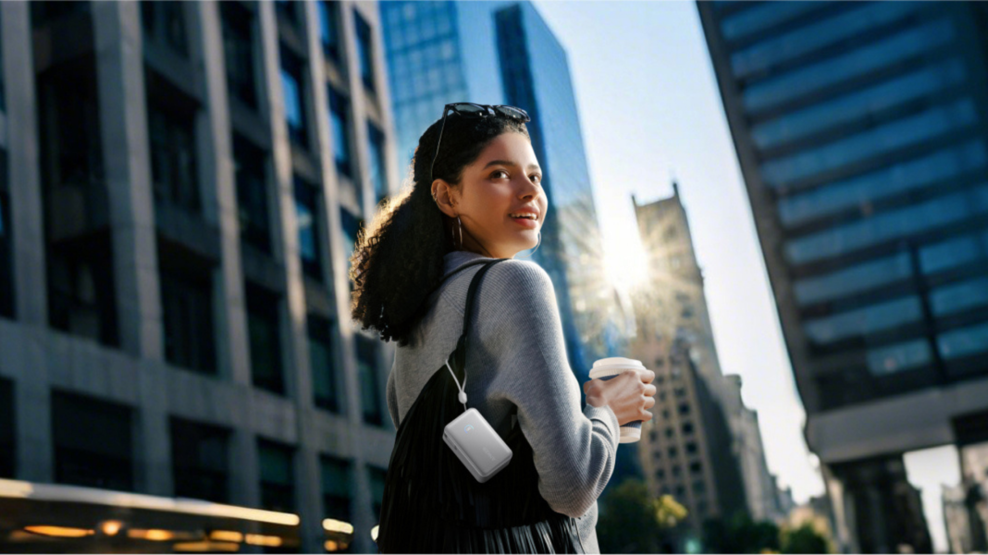 A person with an Anker Nano Power Bank attached to it