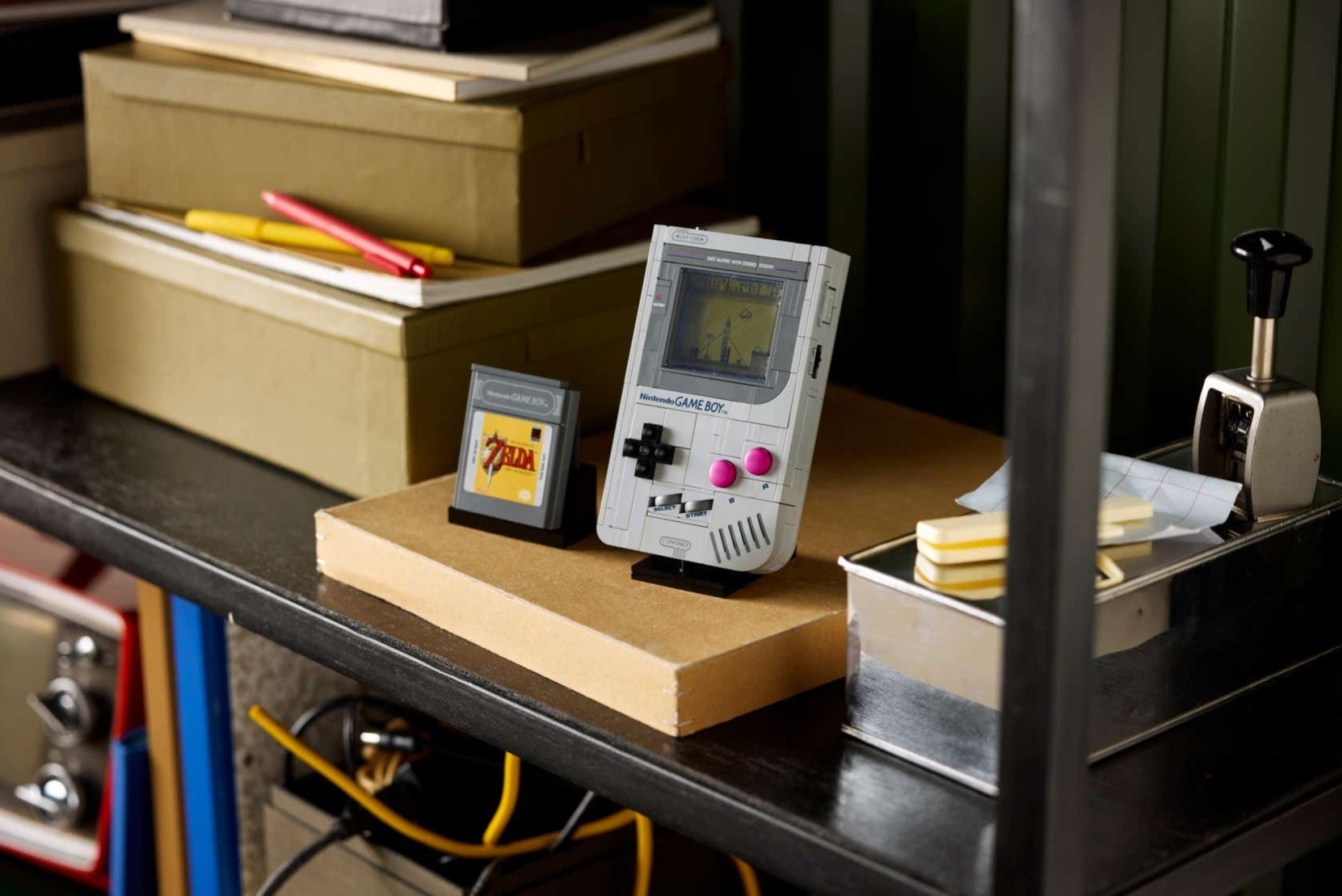 the lego super mario game boy set on a metal shelf