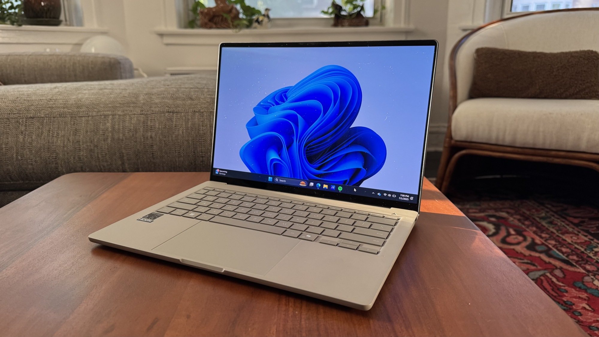 the asus zenbook a14 on a coffee table