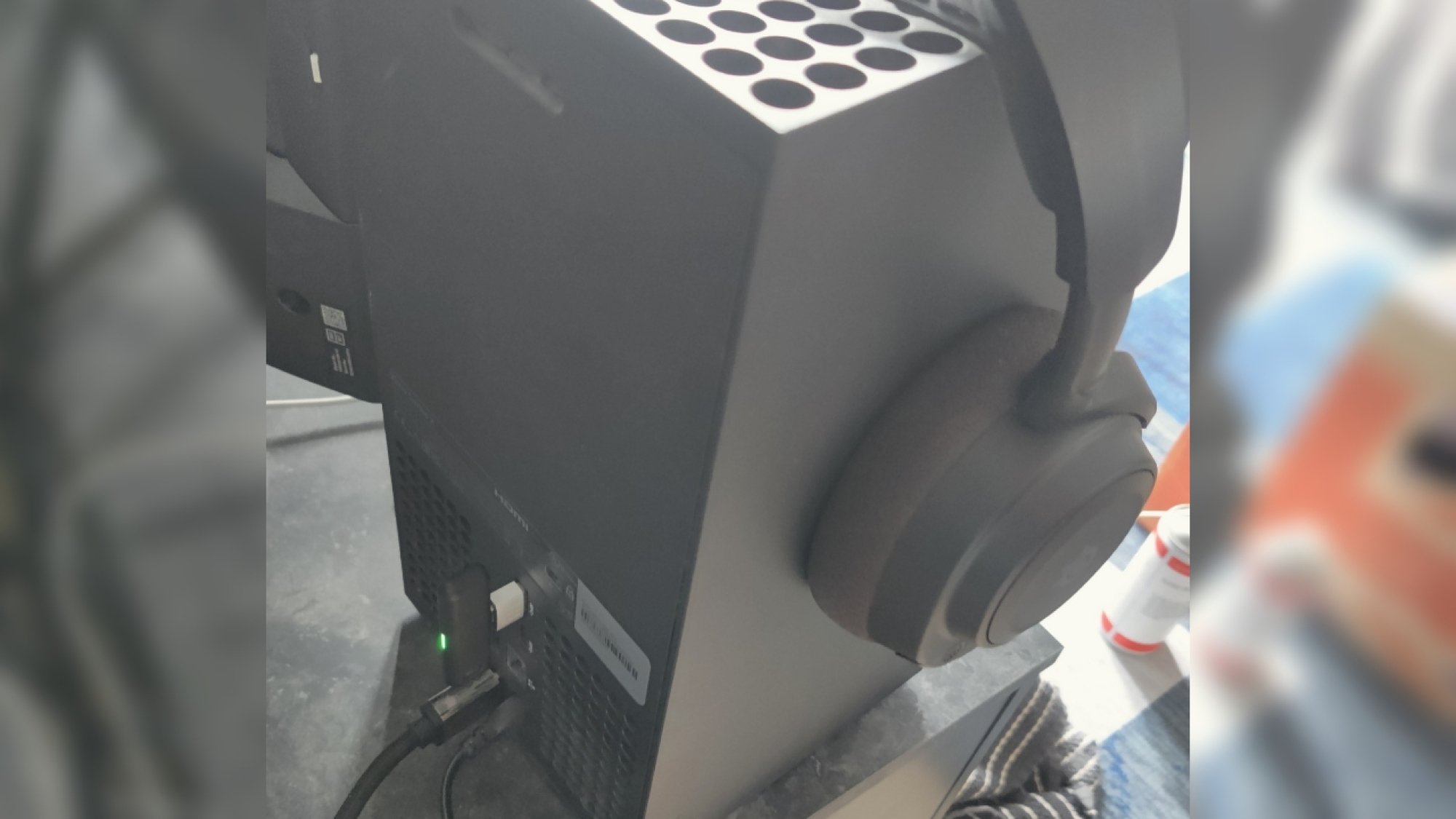 Connecting the SteelSeries Arctis Nova 7X headset to an Xbox Series X with the USB-C via a USB-A adapter in the rear