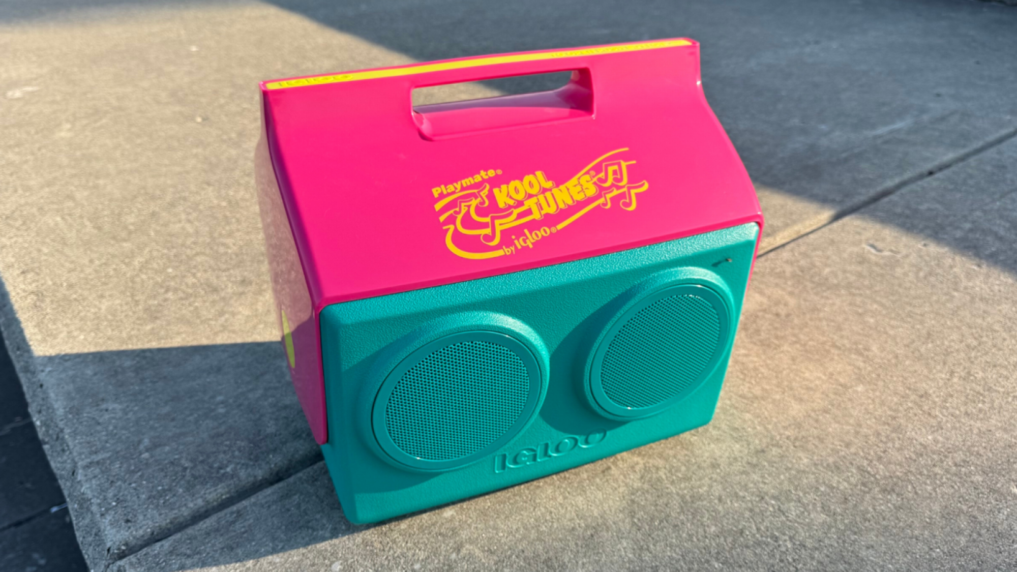 an igloo kooltunes cooler on a concrete surface