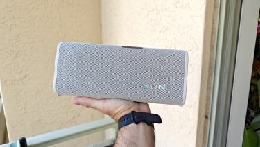 hand holding sony ult field 3 speaker