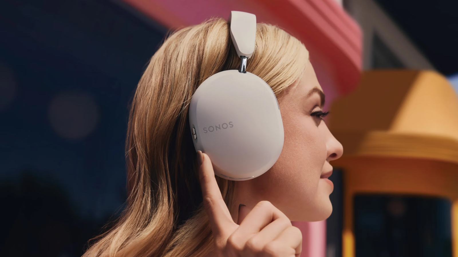 woman wearing Sonos Ace headphones in soft white