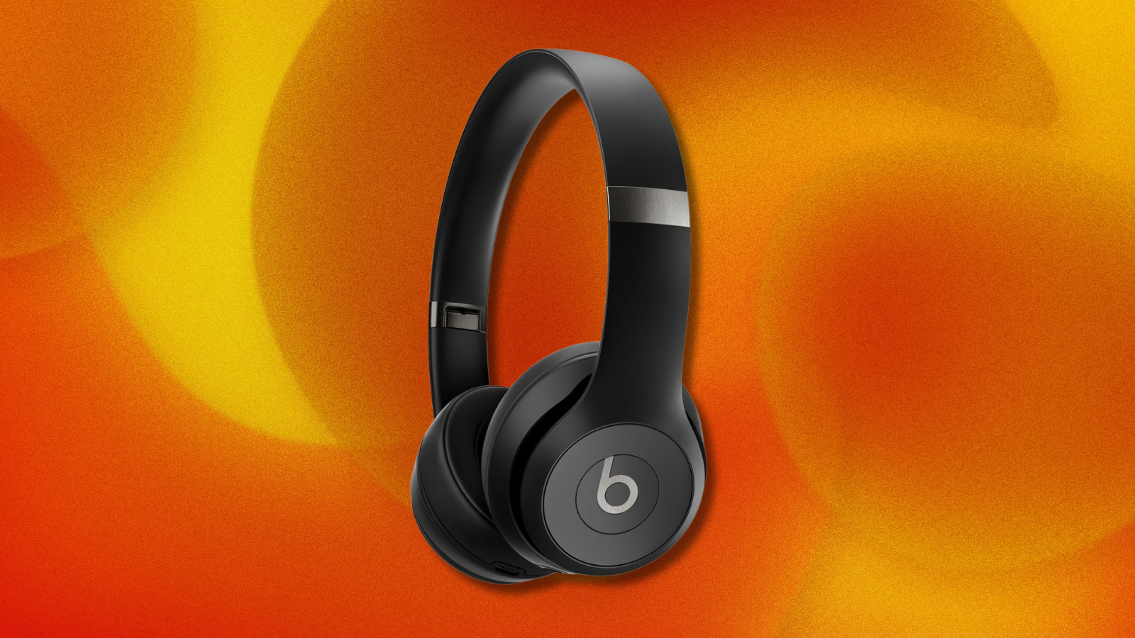 Beats Solo 4 on orange and yellow abstract background