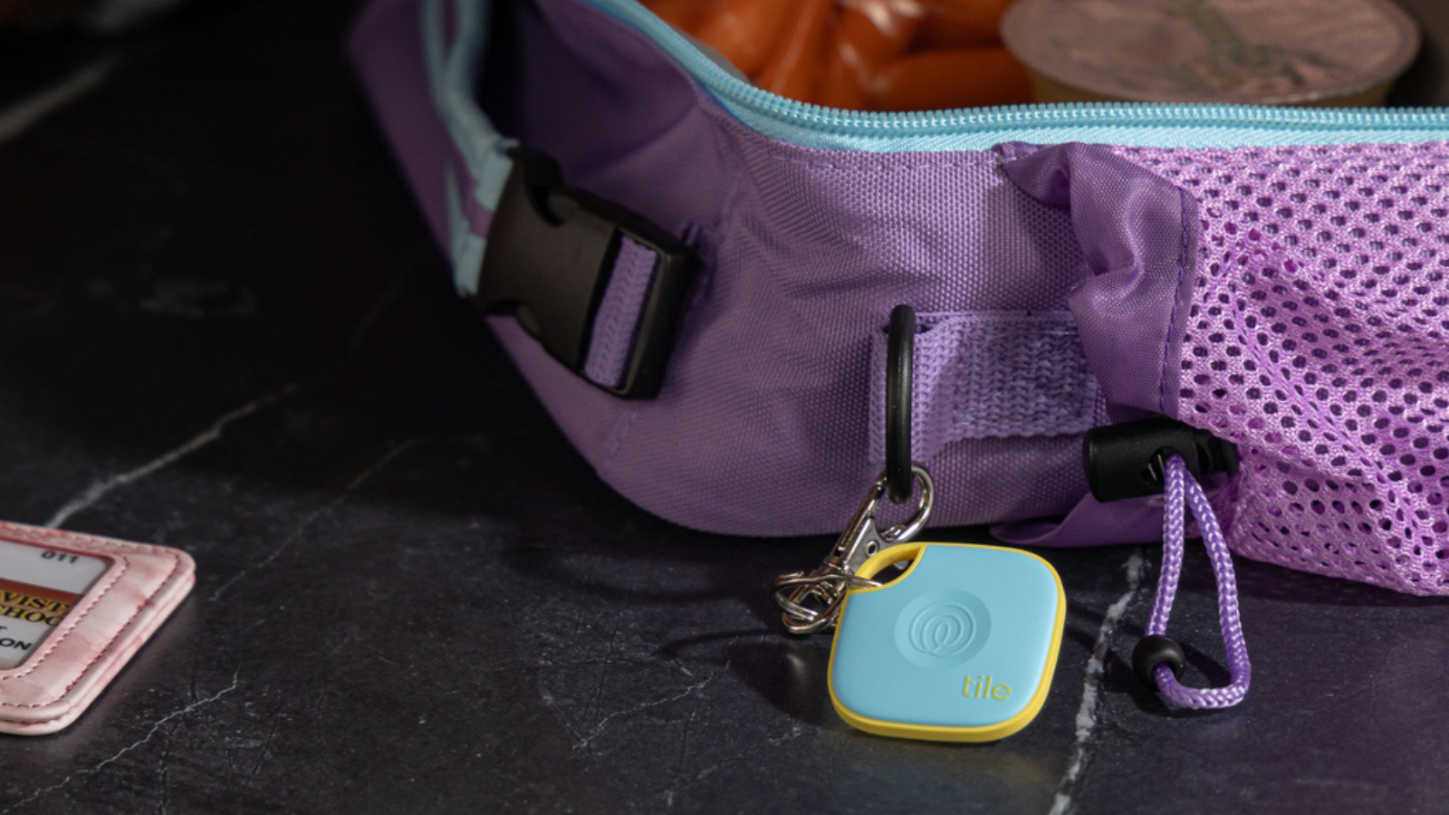 backpack with blue Tile Mate tracker attached