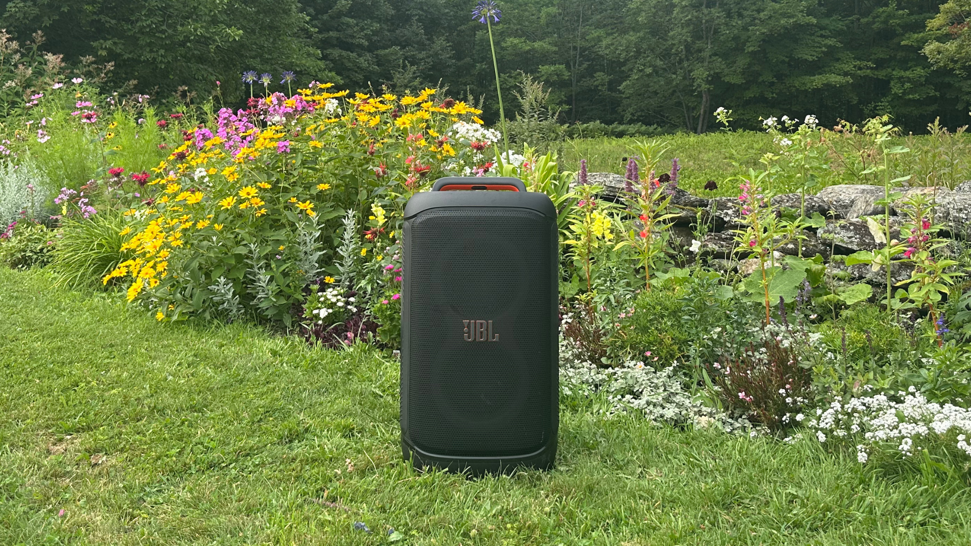 A JBL PartyBox 520 in the garden