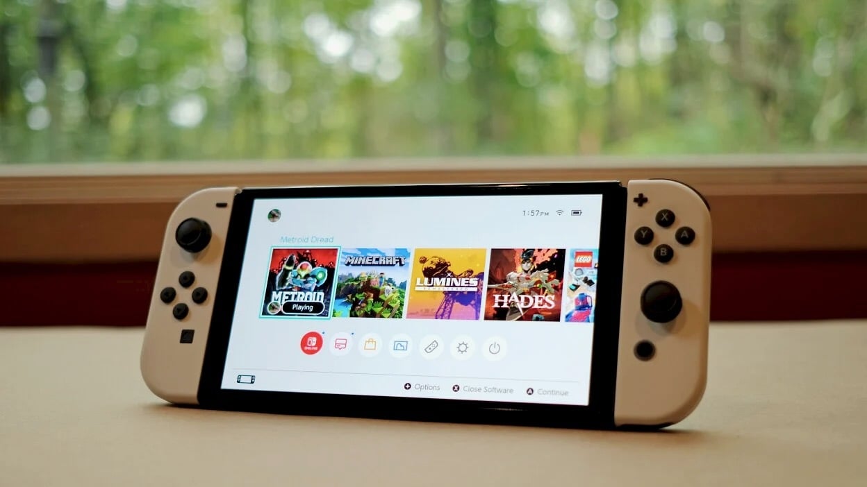 nintendo switch oled in front of window