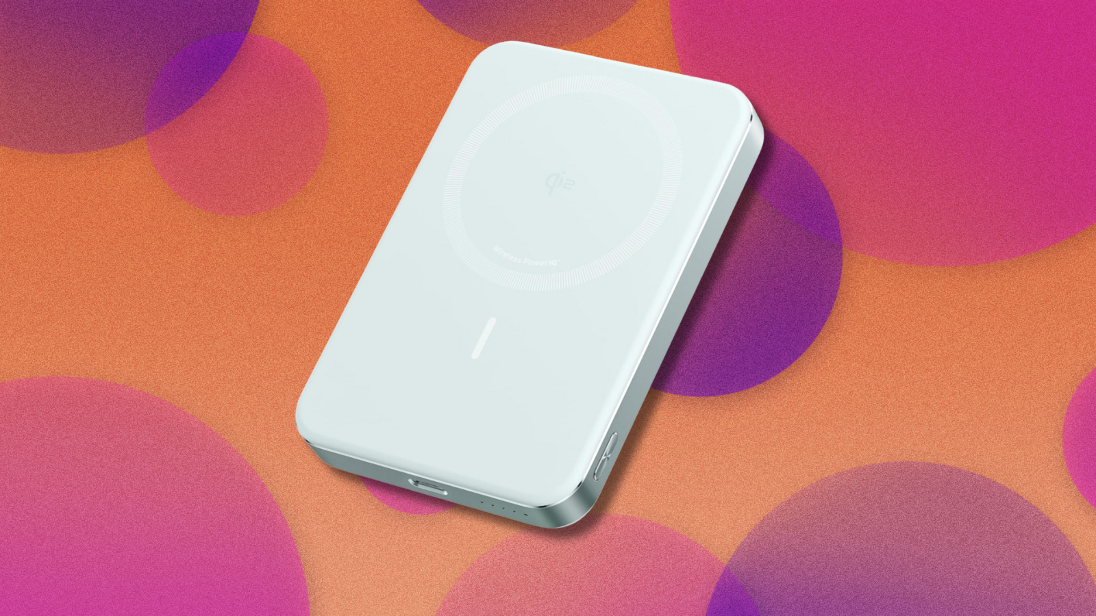 Anker MagGo Power Bank on orange and purple abstract background