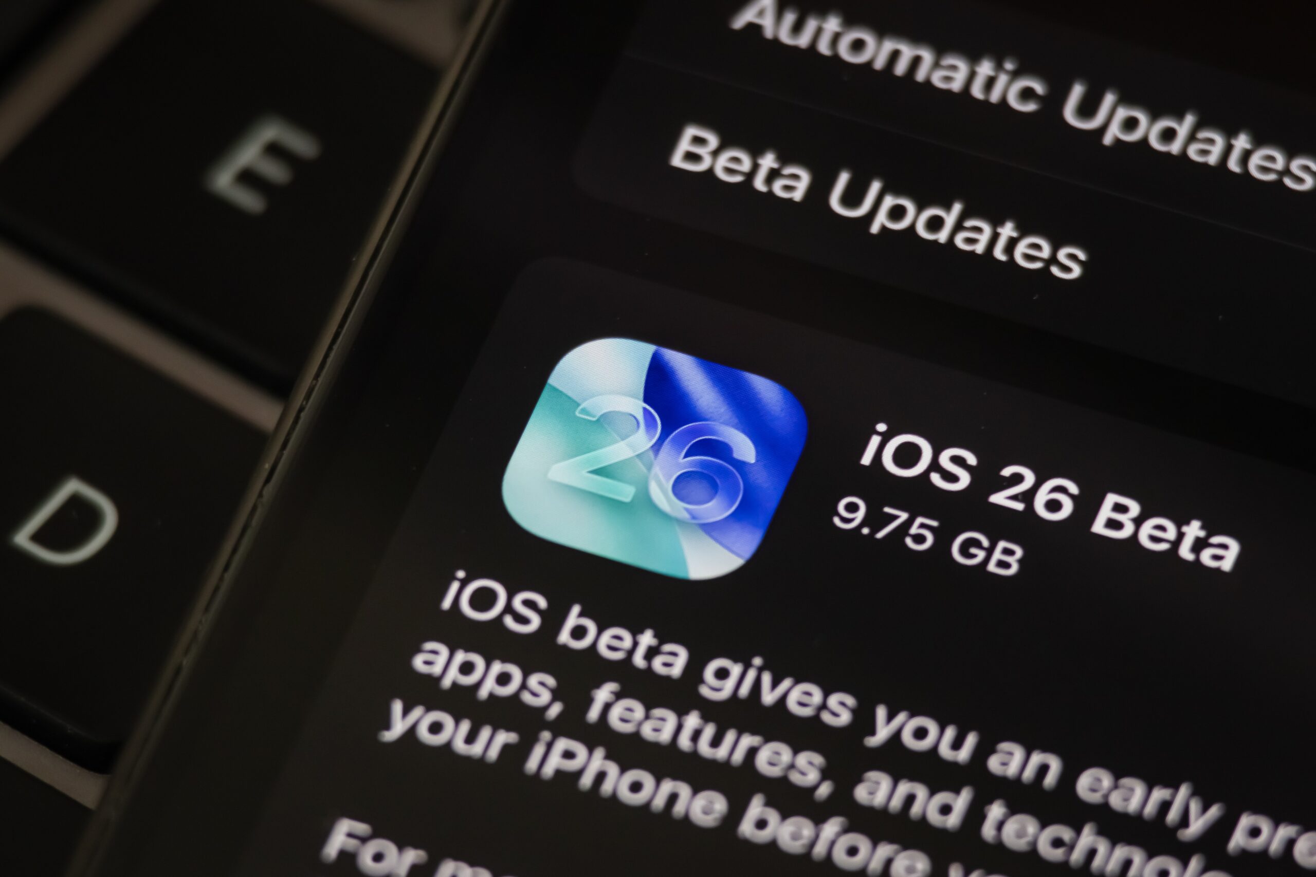  the iOS 26 Beta update screen is displayed on an iPhone, showing a download size of 9.75 GB