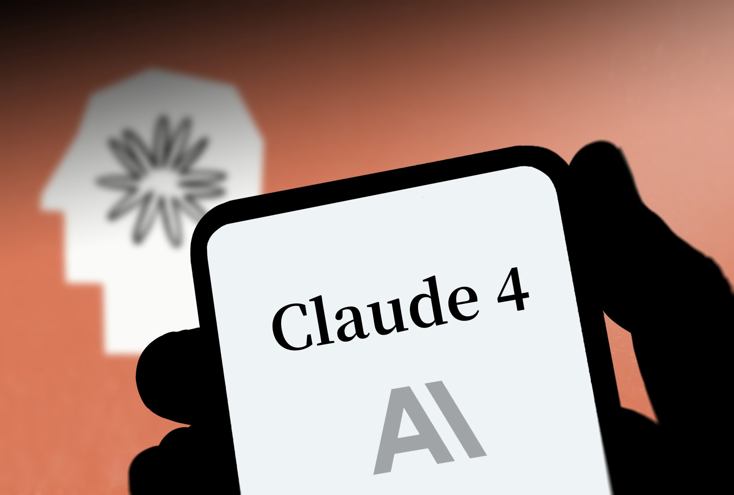 The logo of Claude 4 is displayed on a smartphone screen on May 23, 2025 in Beijing, China. Anthropic on May 22 said it activated a tighter artificial intelligence control for Claude Opus 4, its latest AI model. 