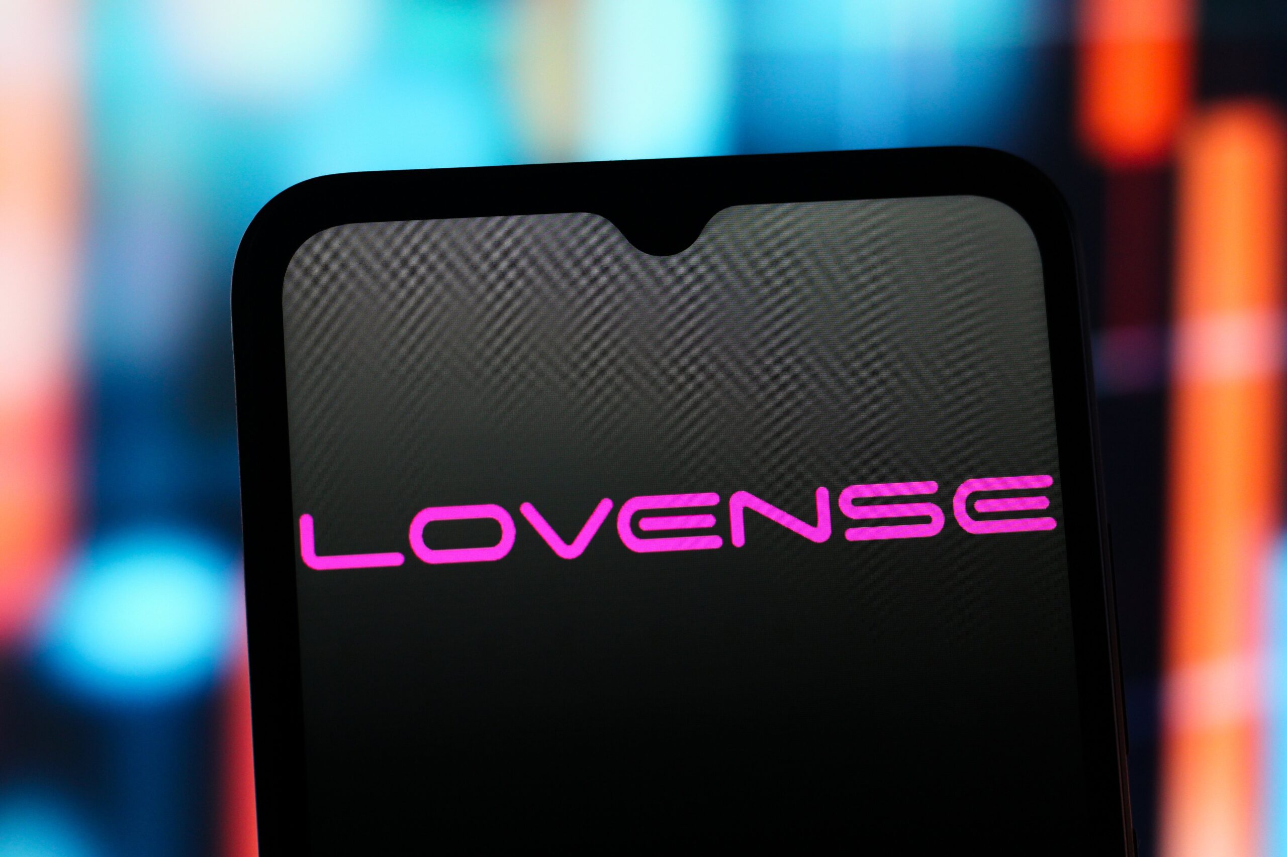  the Lovense logo is seen displayed on a smartphone screen