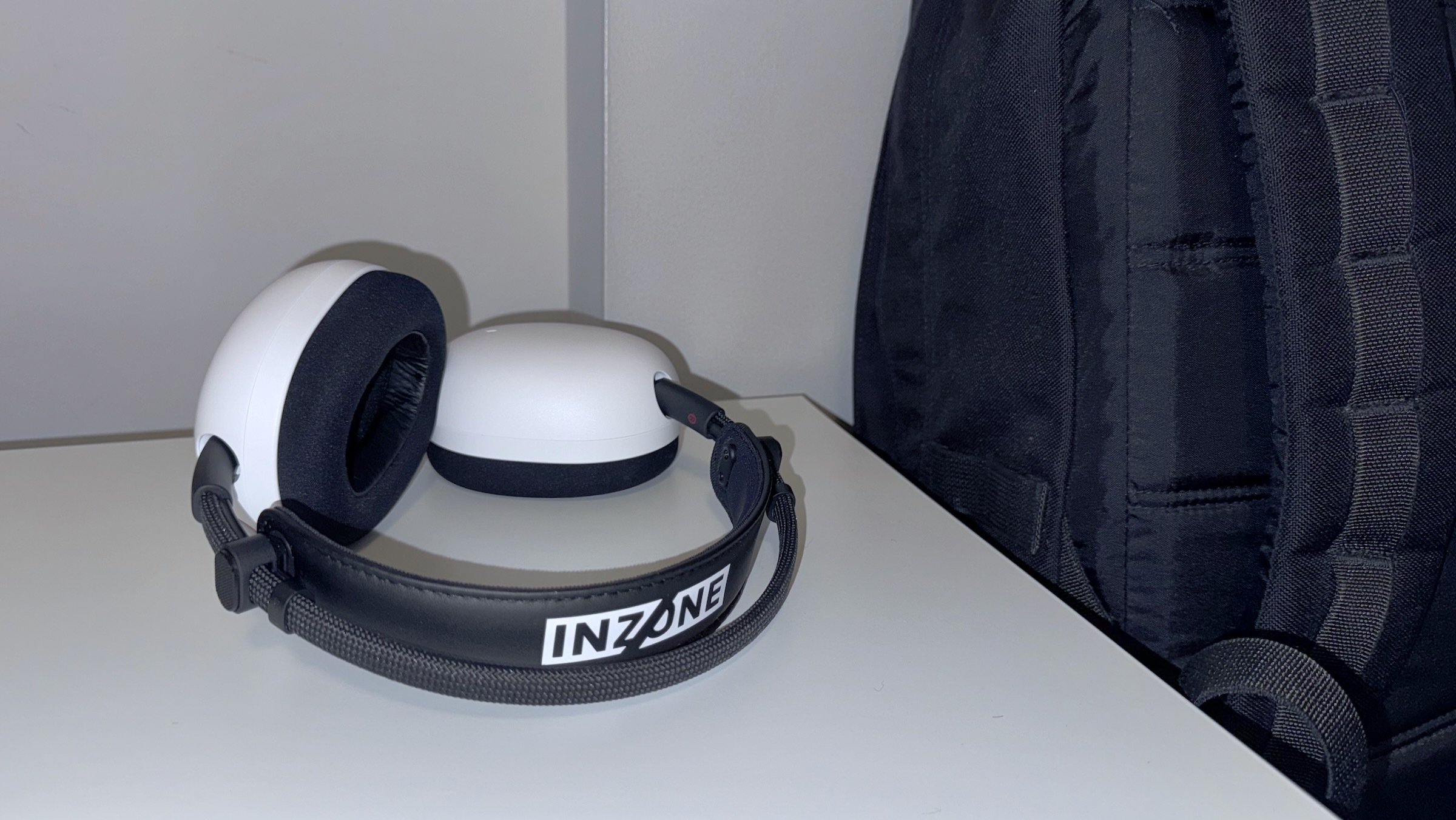 Sony Inzone H9 II Noise-cancelling headphones next to black backpack