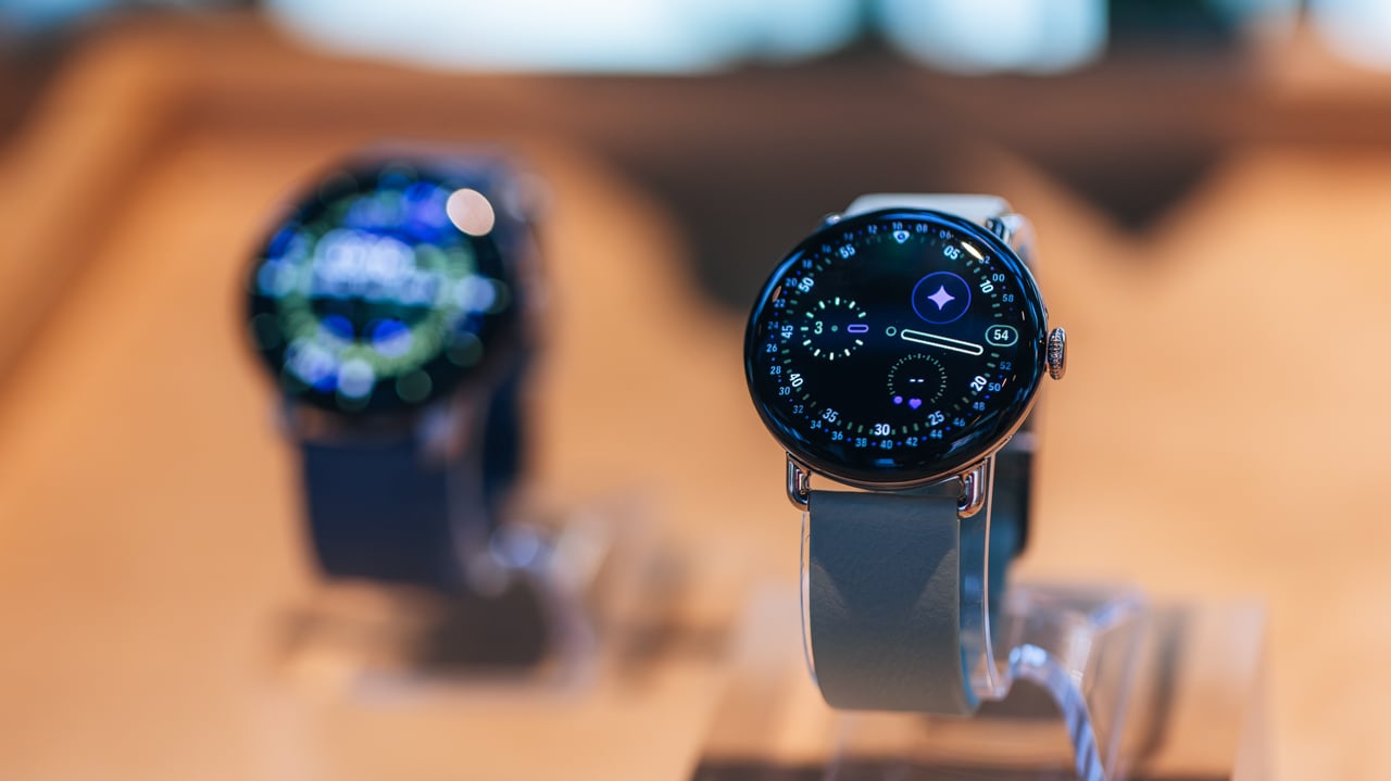 A image of two Pixel Watch 4's on display on a table
