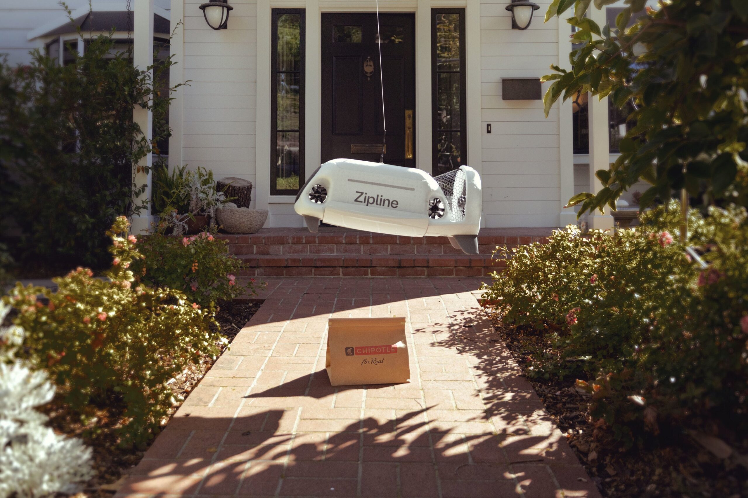 a zipline drone delivery chipotle food