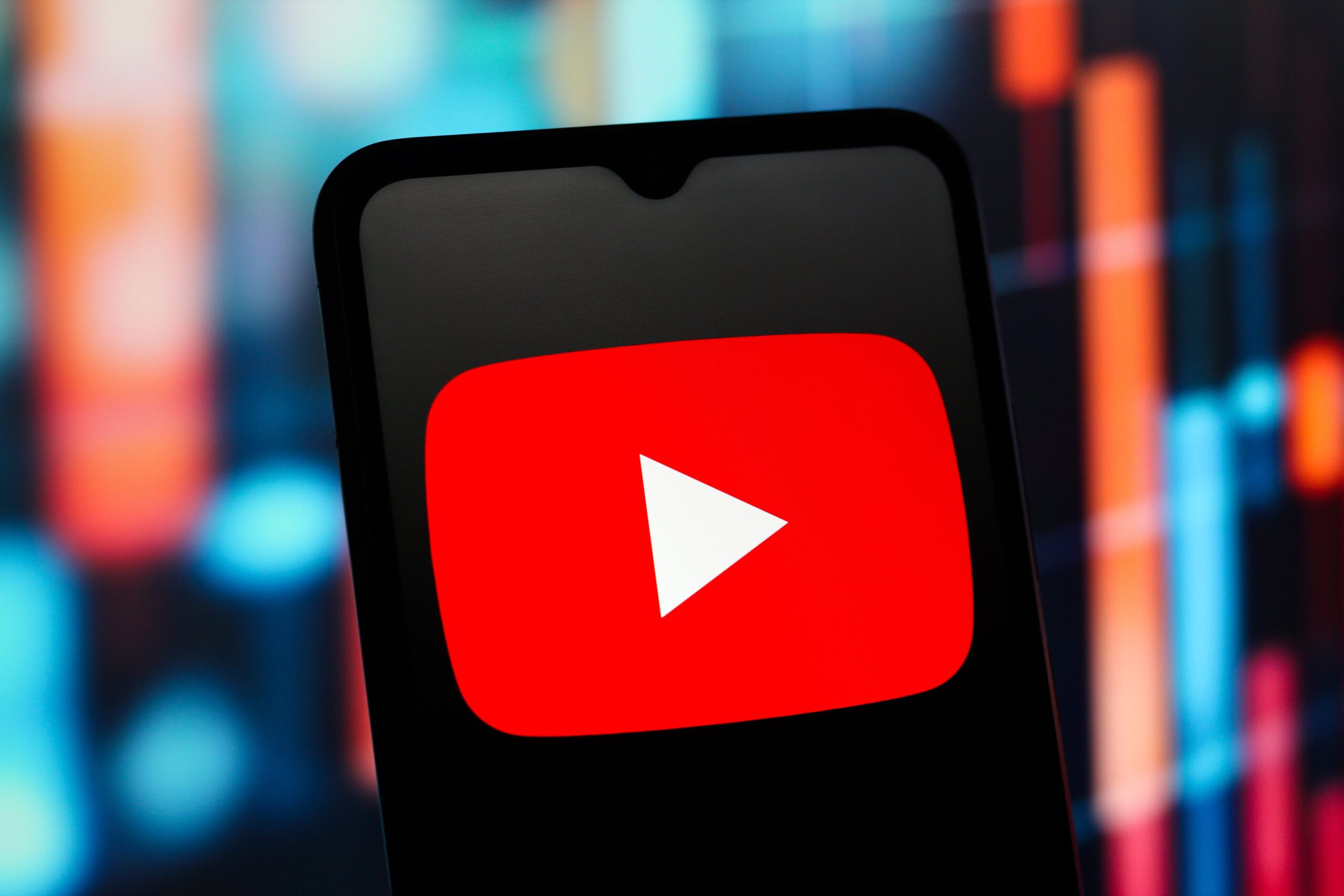 the YouTube (YouTube) logo is seen displayed on a smartphone screen