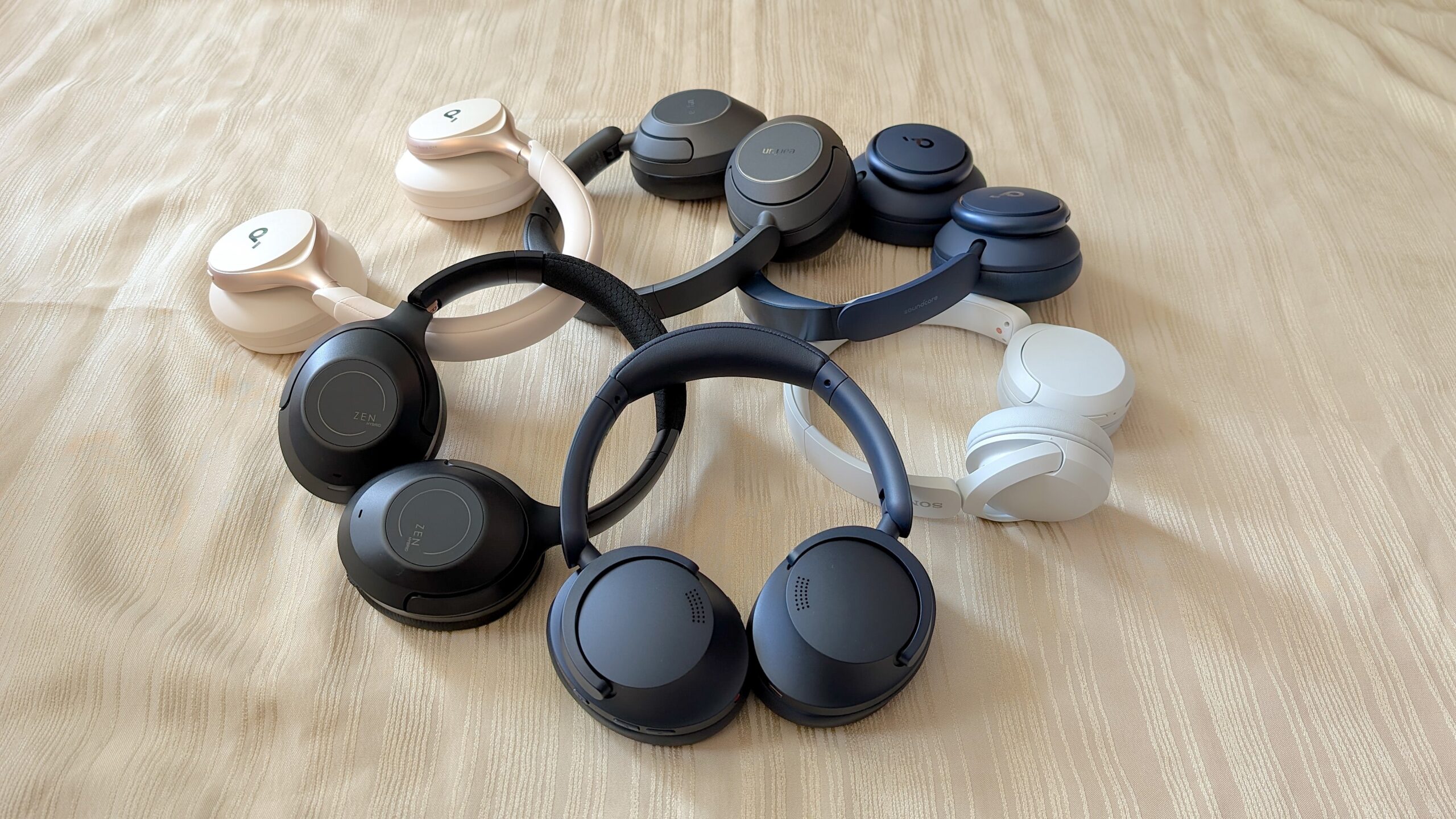 pairs of headphones piled up on each other