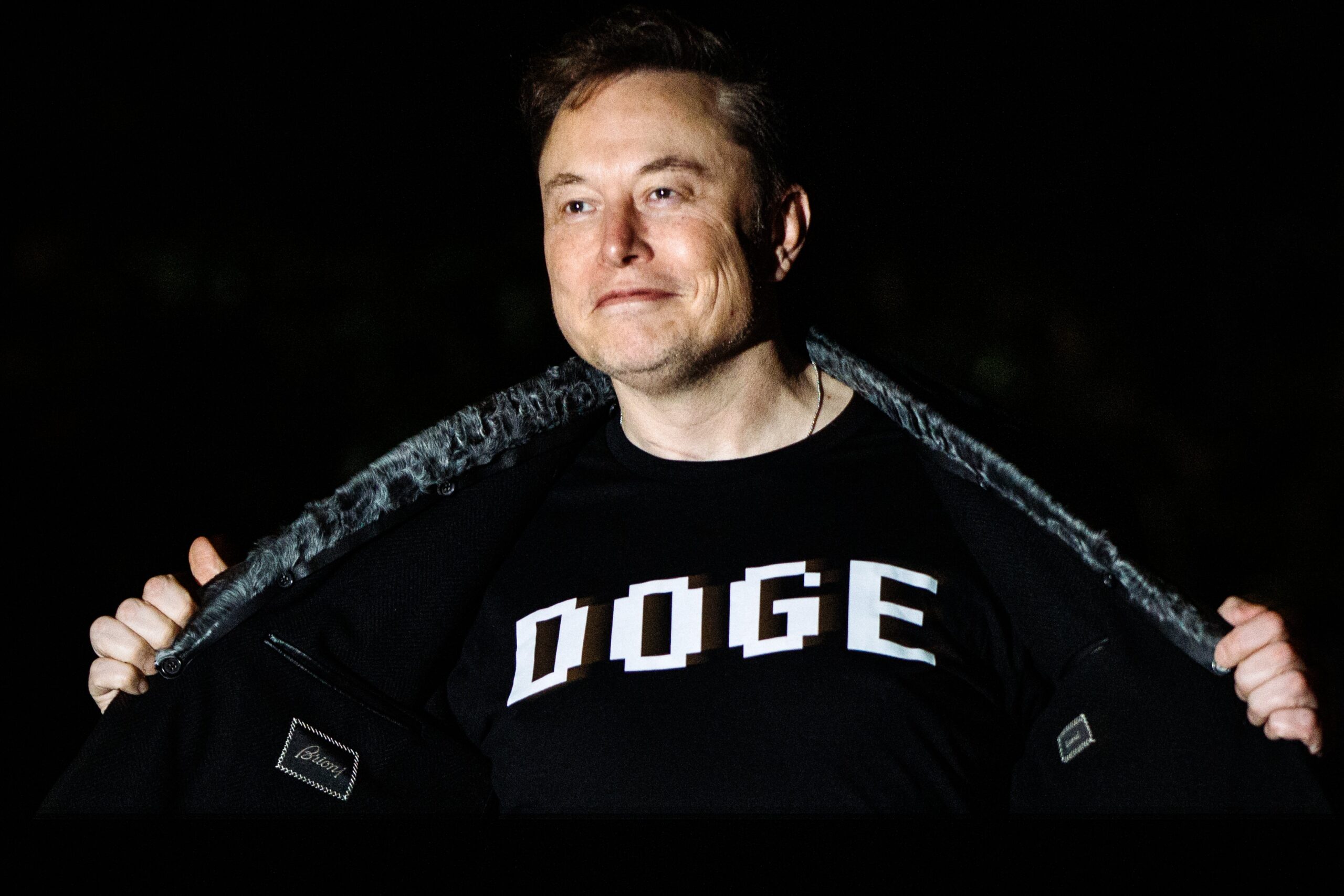 Elon Musk wearing a DOGE shirt