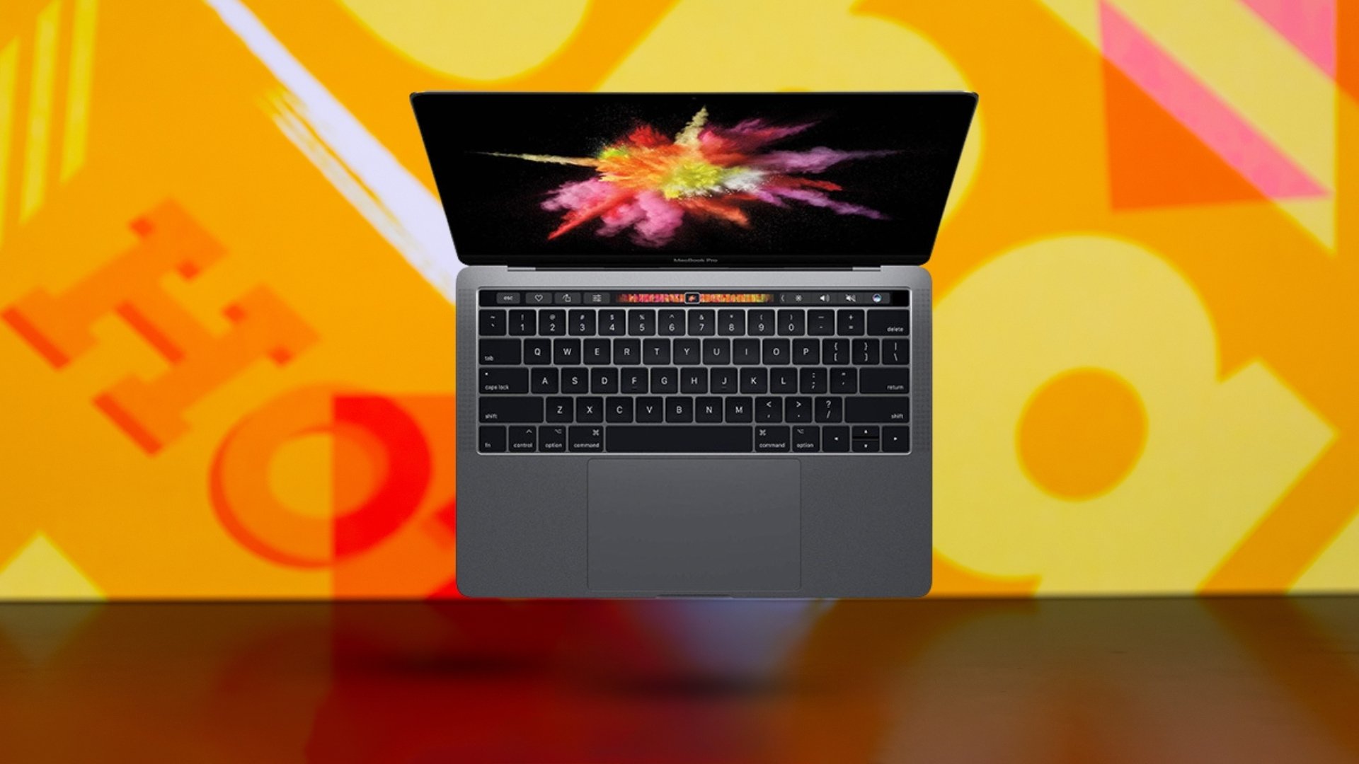 Apple MacBook Pro on yellow background