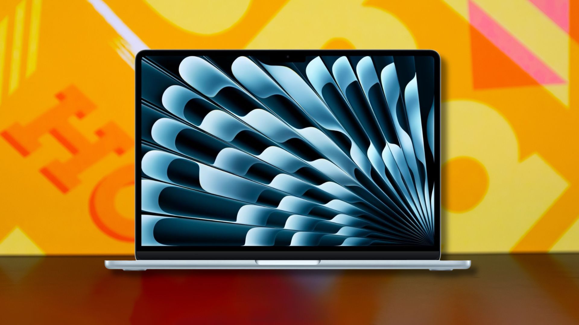 apple macbook air laptop against a yellow patterned background