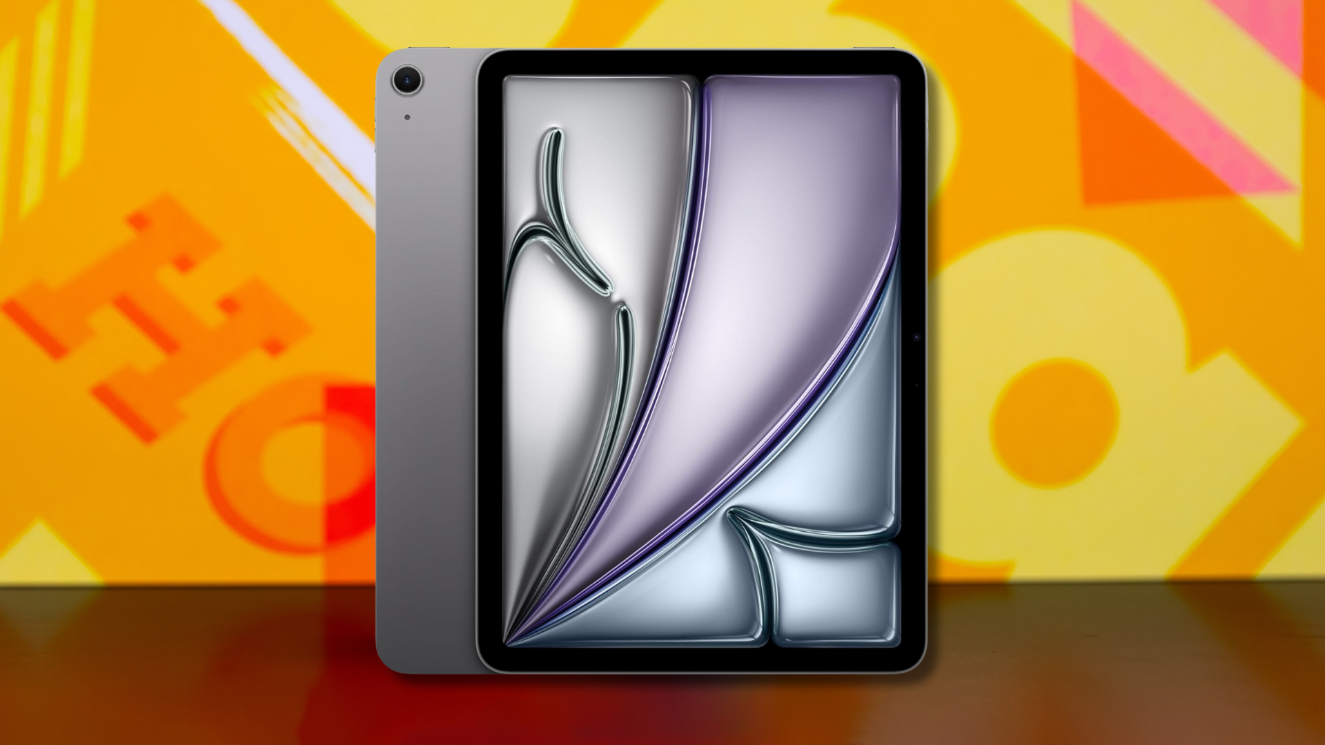 An Apple iPad Air against a colorful background