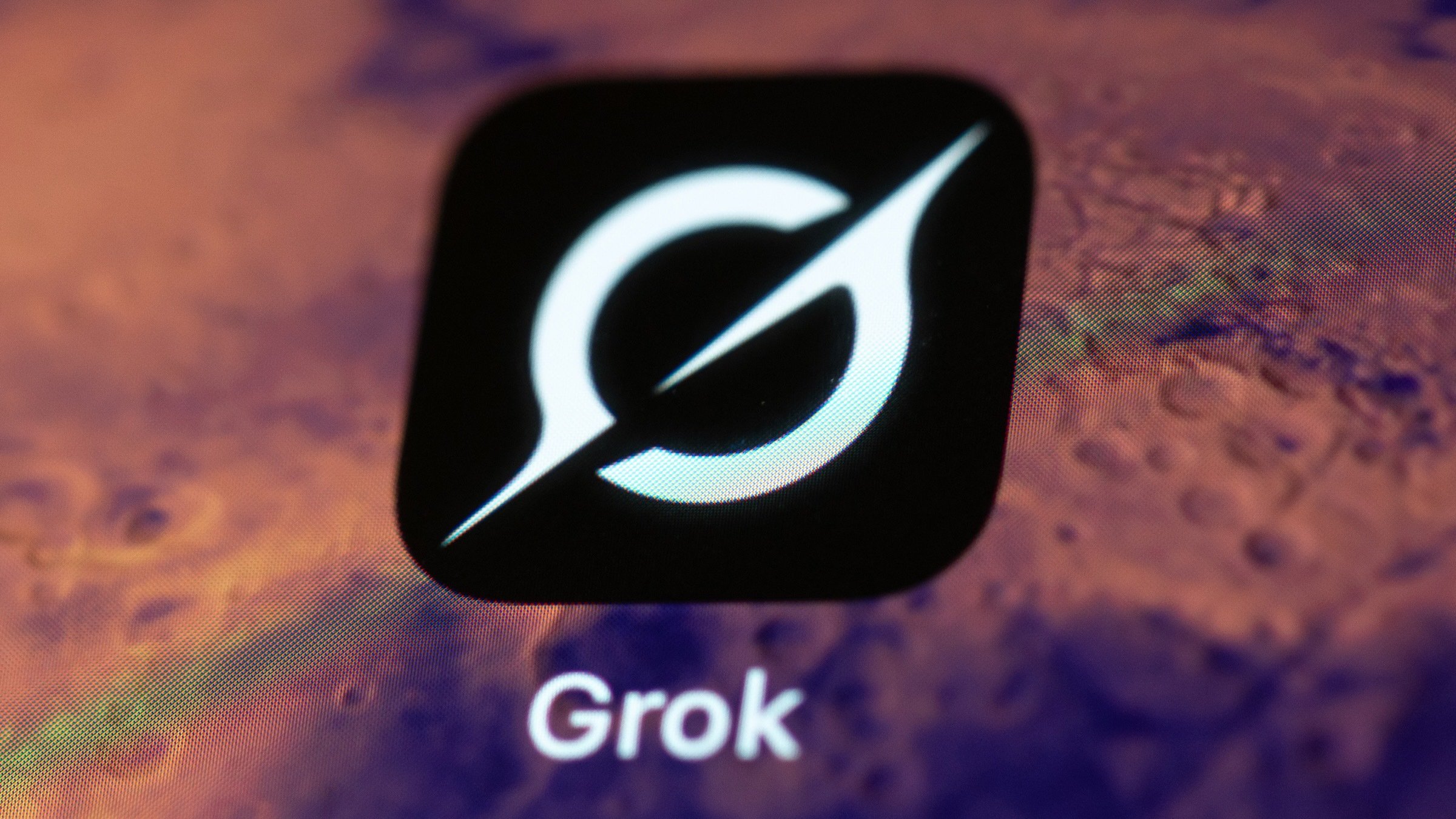 The Grok app on a smartphone with a mars wallpaper