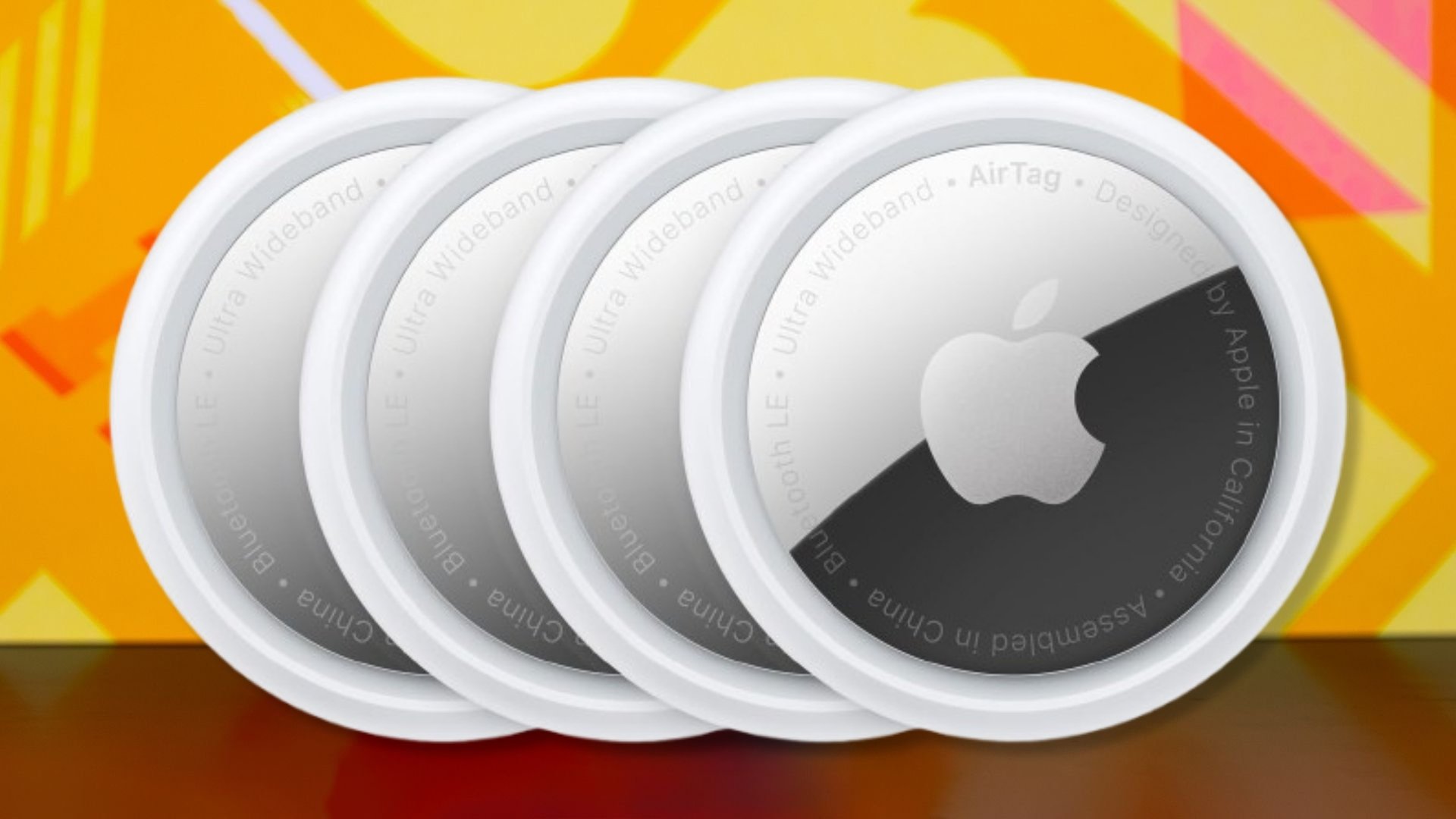The Apple AirTag 4 Pack on an orange background