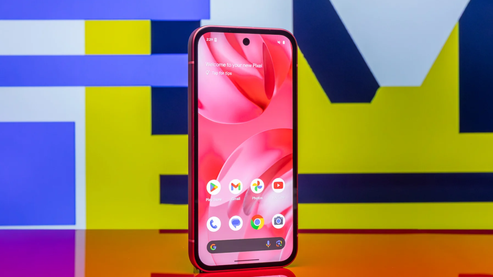 the google pixel 9a against a multicolored background