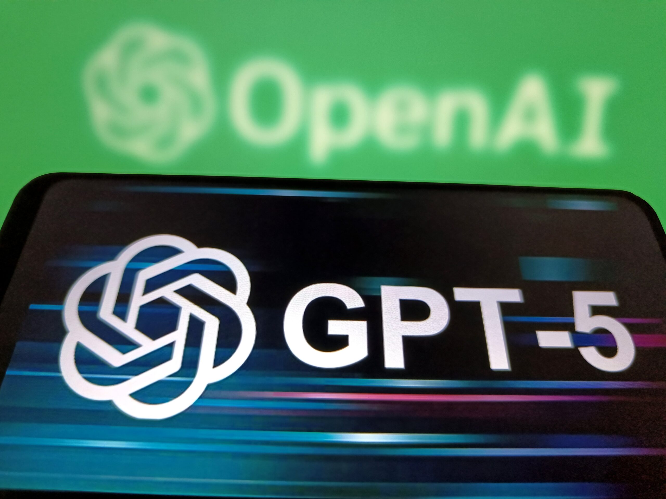 A illustration photo shows the GPT-5 displayed in a smartphone with the OpenAI logo in background in Suqian, Jiangsu Province, China on August 7, 2025. 