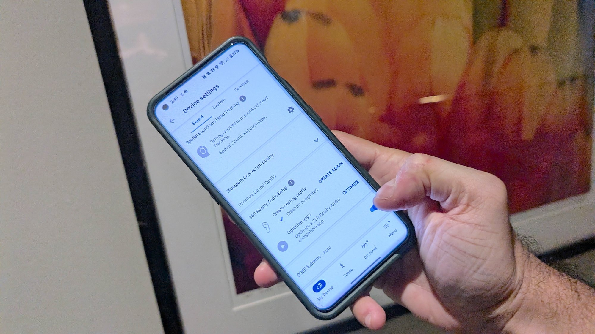 A phone with the Sony Sound Connect app open, the person is toggling DSEE Extreme on