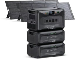 the bluetti apex 300 with expandable batteries and solar panels in the background