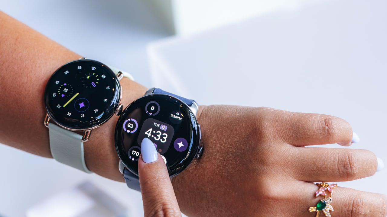 woman tapping pixel watch 4 screen with finger