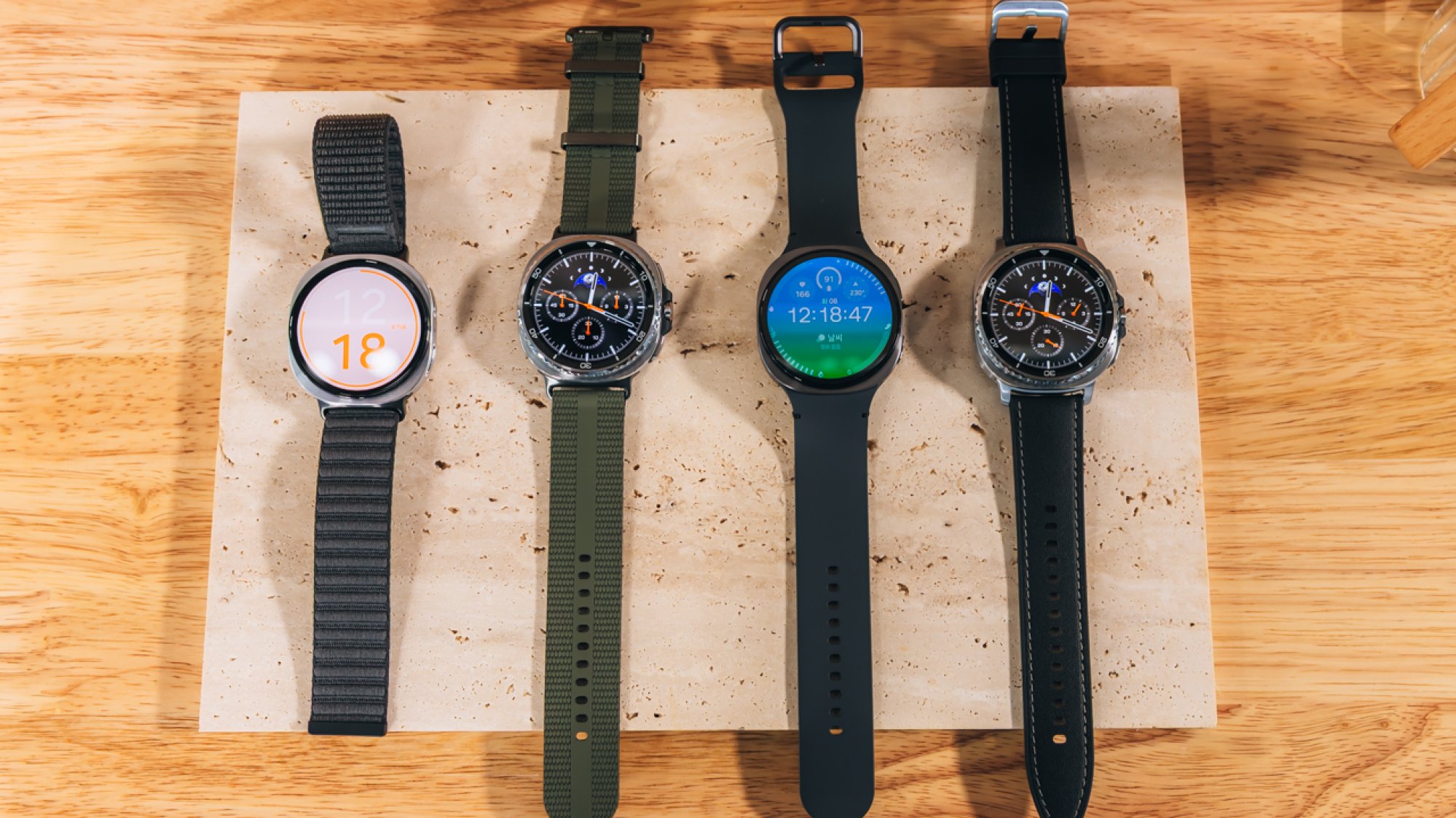 four samsung galaxy watch 8 smartwatches with different bands