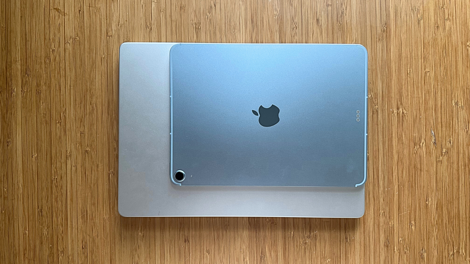 An 11-inch iPad on top of a 13-inch MacBook