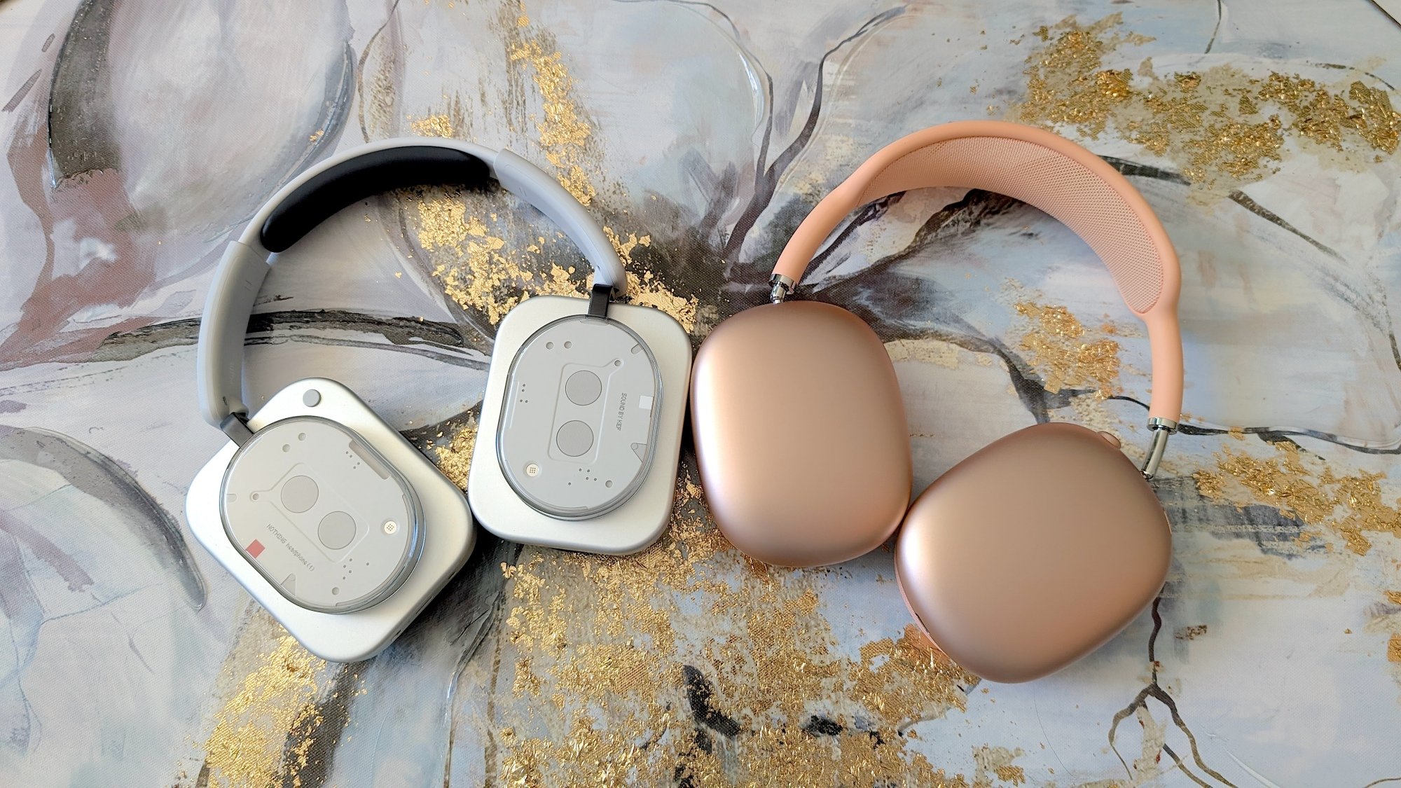 nothing headphones next to apple airpods max