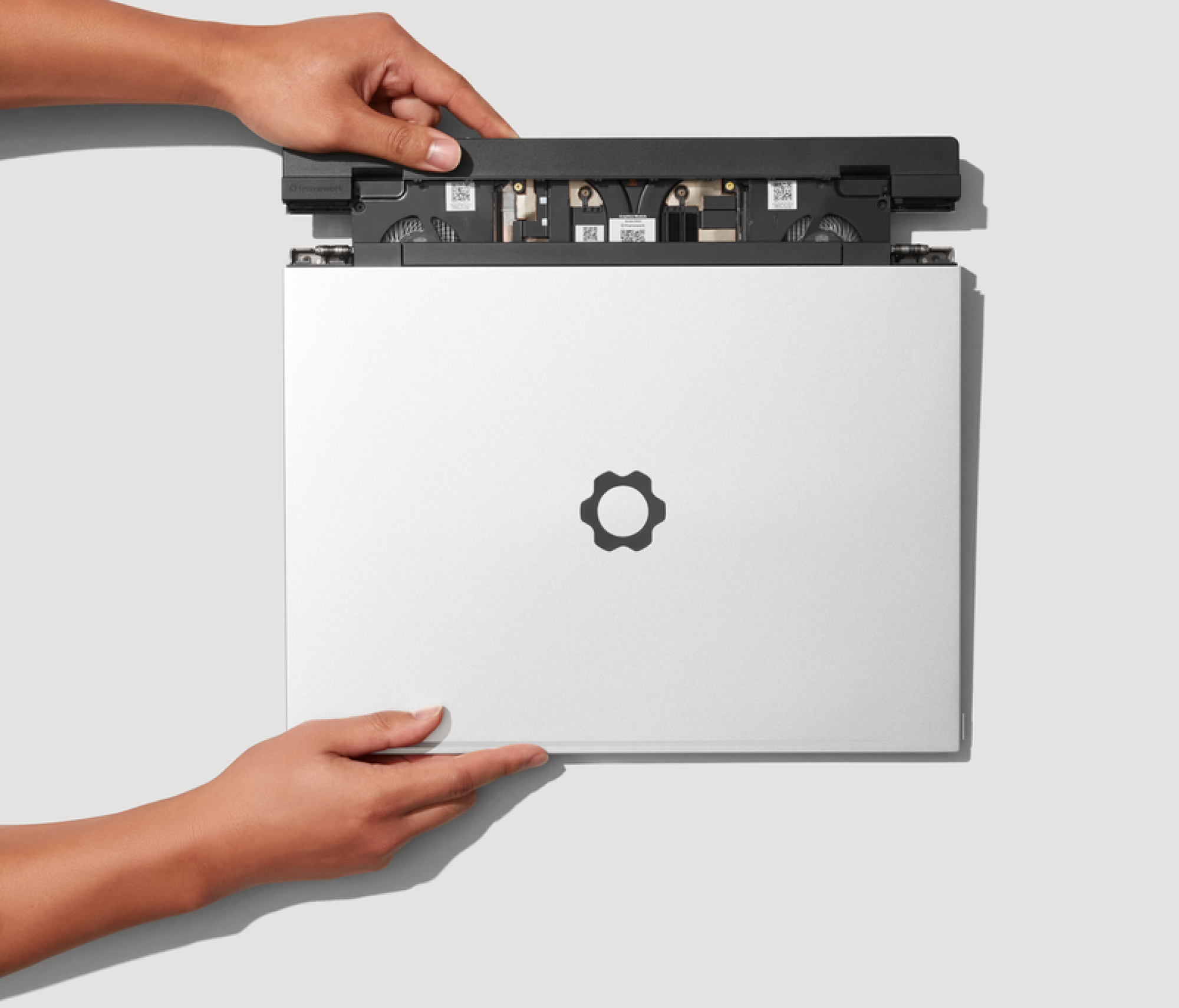 a person sliding out the framework laptop 16's graphics module