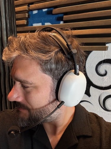 the author wearing sony inzone h9 ii headset in white