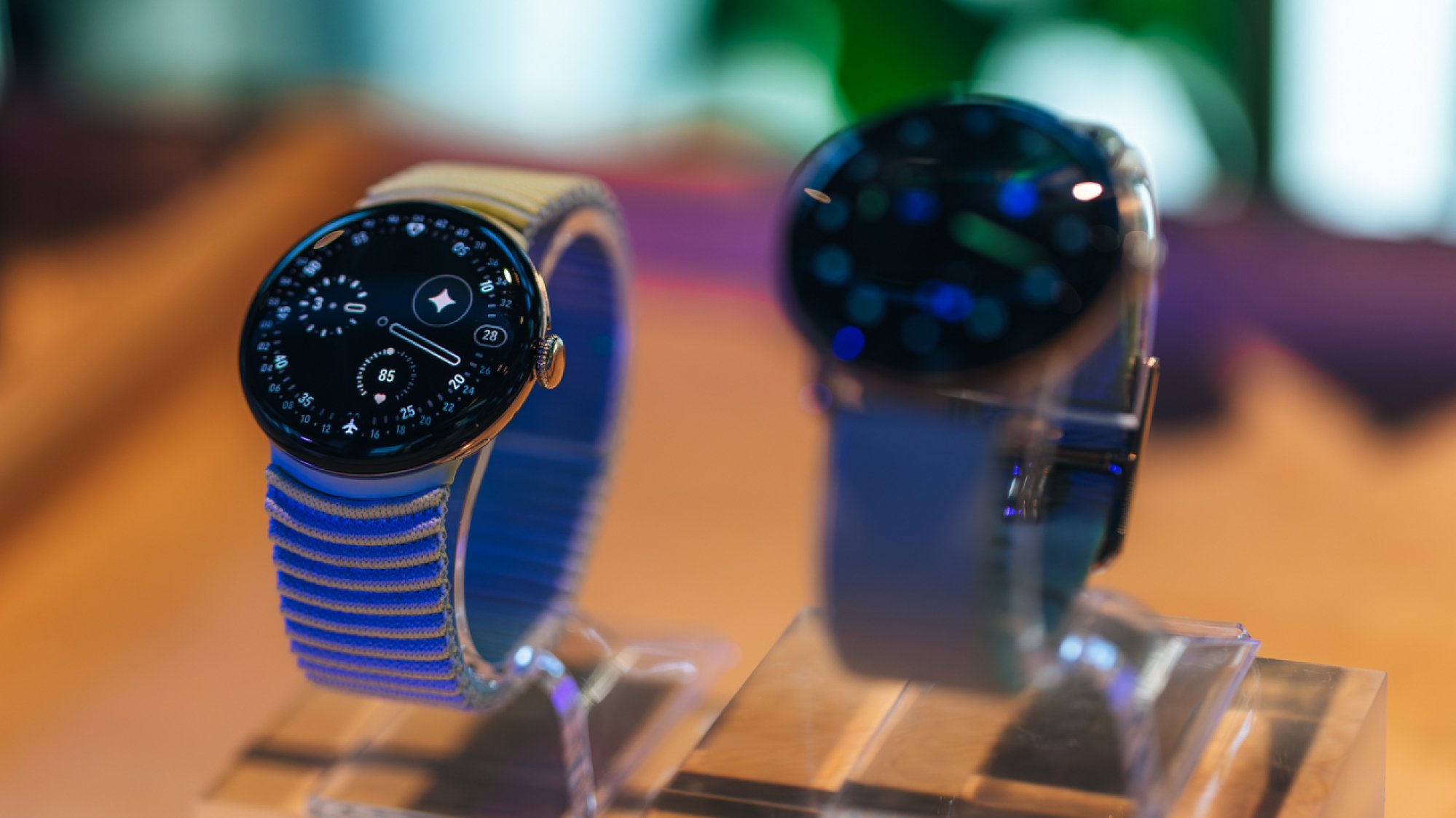 close-up portrait of two pixel watch 4 smartwatches