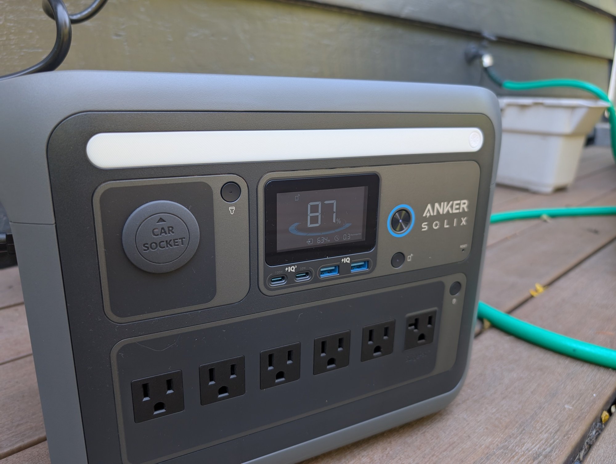 the anker solix c1000 portable power station on a deck