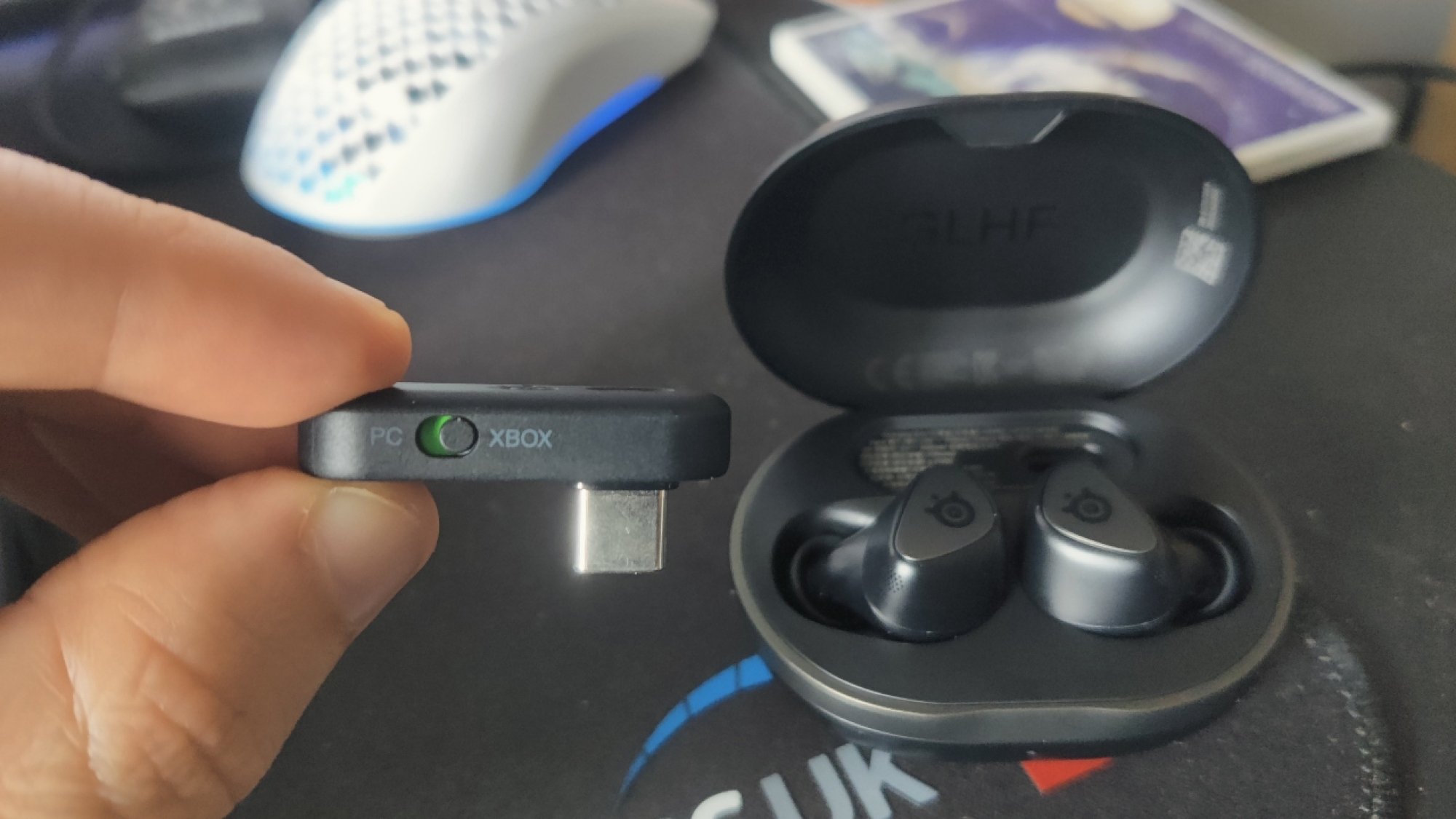 The USB-C dongle for the SteelSeries Arctis GameBuds in 'Xbox' mode