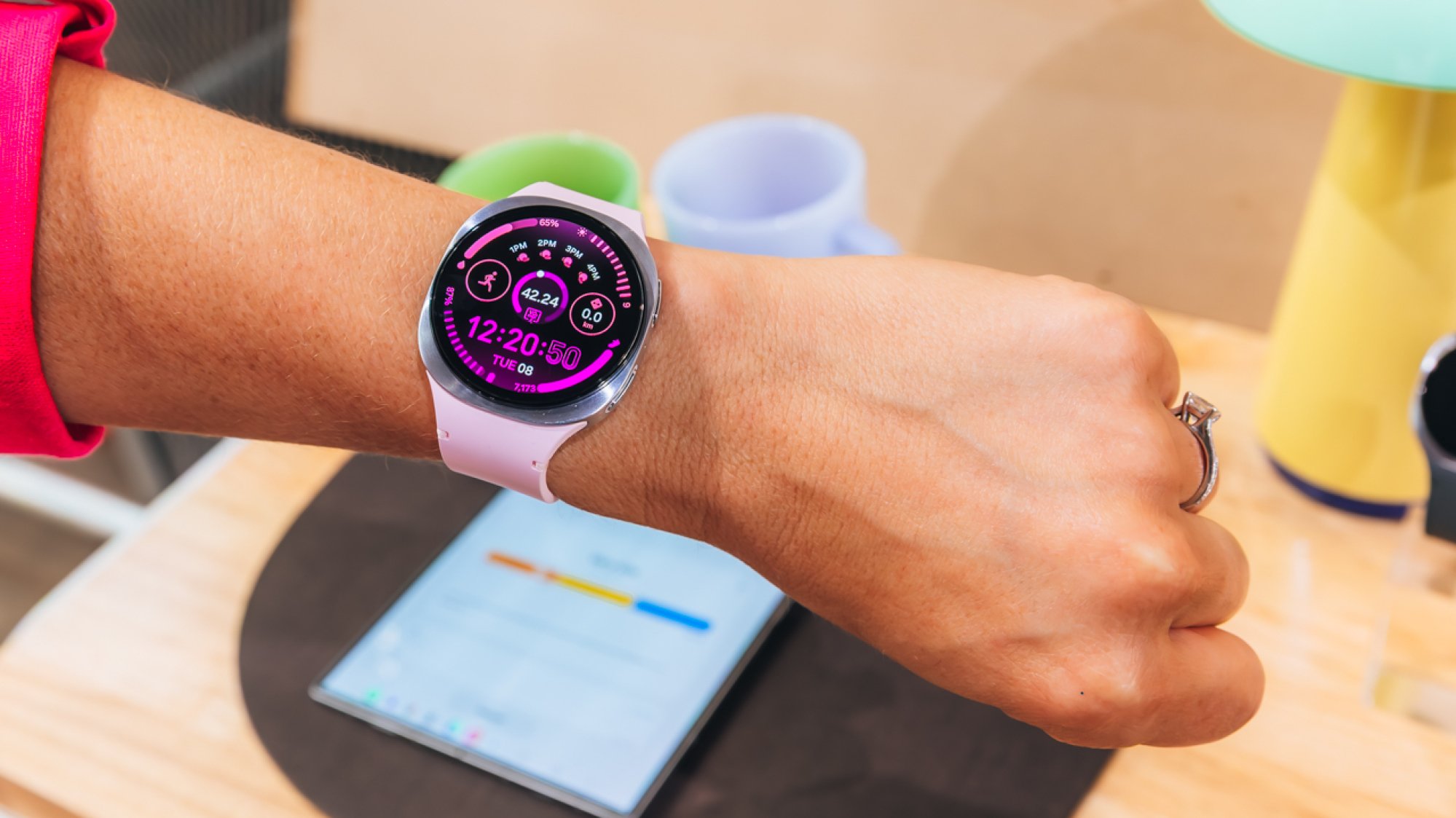 galaxy watch 8 with pink band on woman's wrist