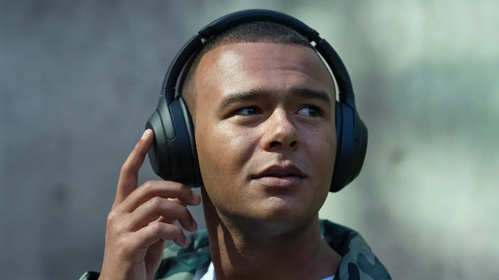 man wearing Sony WH-1000XM4 headphones