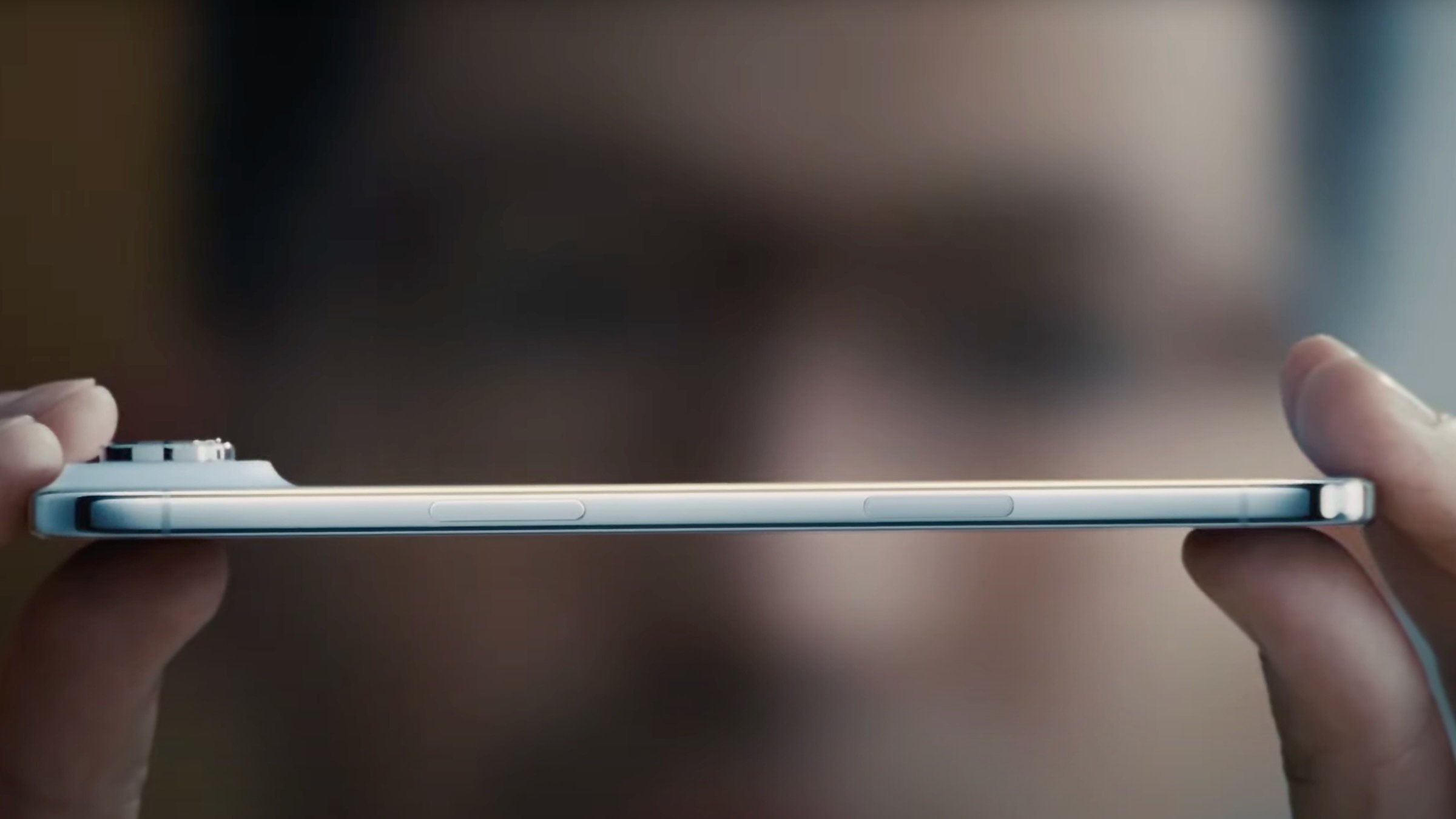 iphone air held between man's fingers