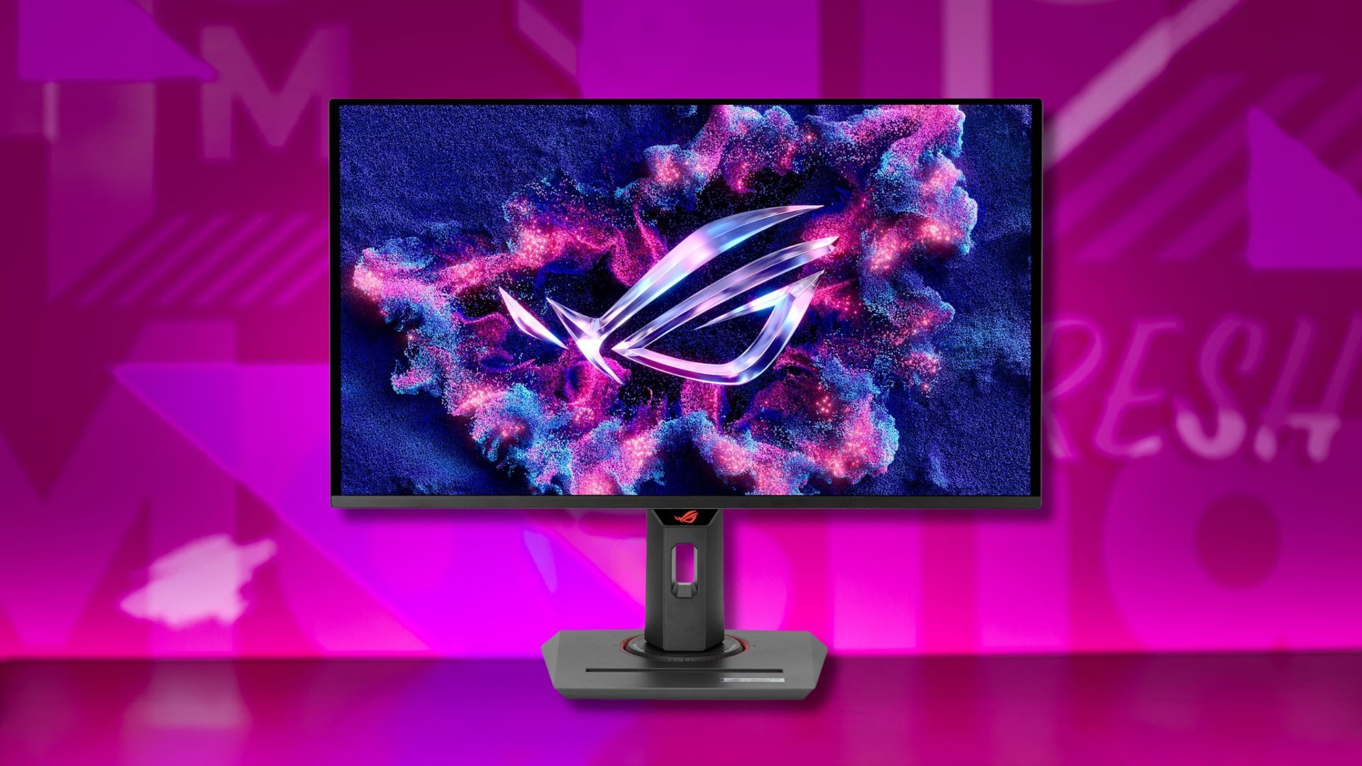 asus rog strix gaming monitor against a pink patterned background