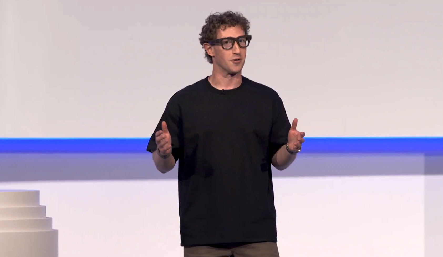 Mark Zuckerberg with a pair of thick frames on.