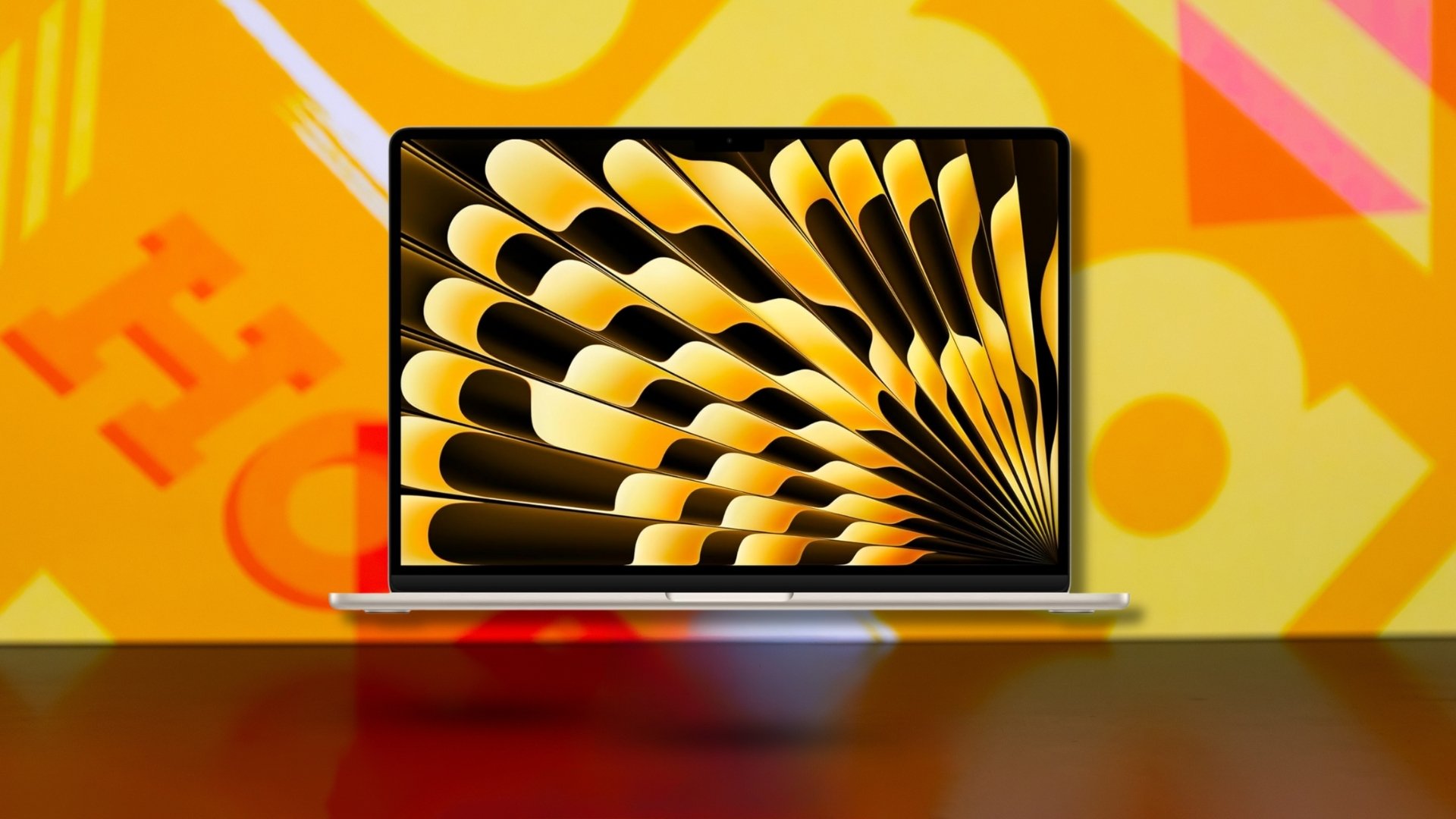 Apple MacBook on yellow background