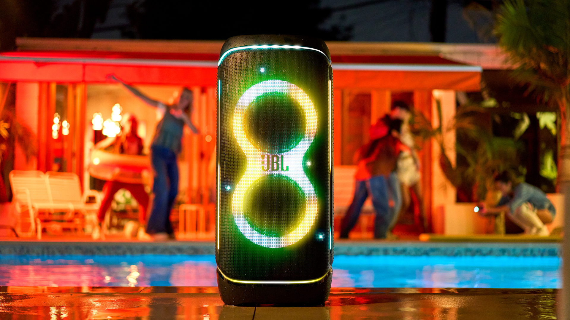 A JBL PartyBox 720 next to a pool