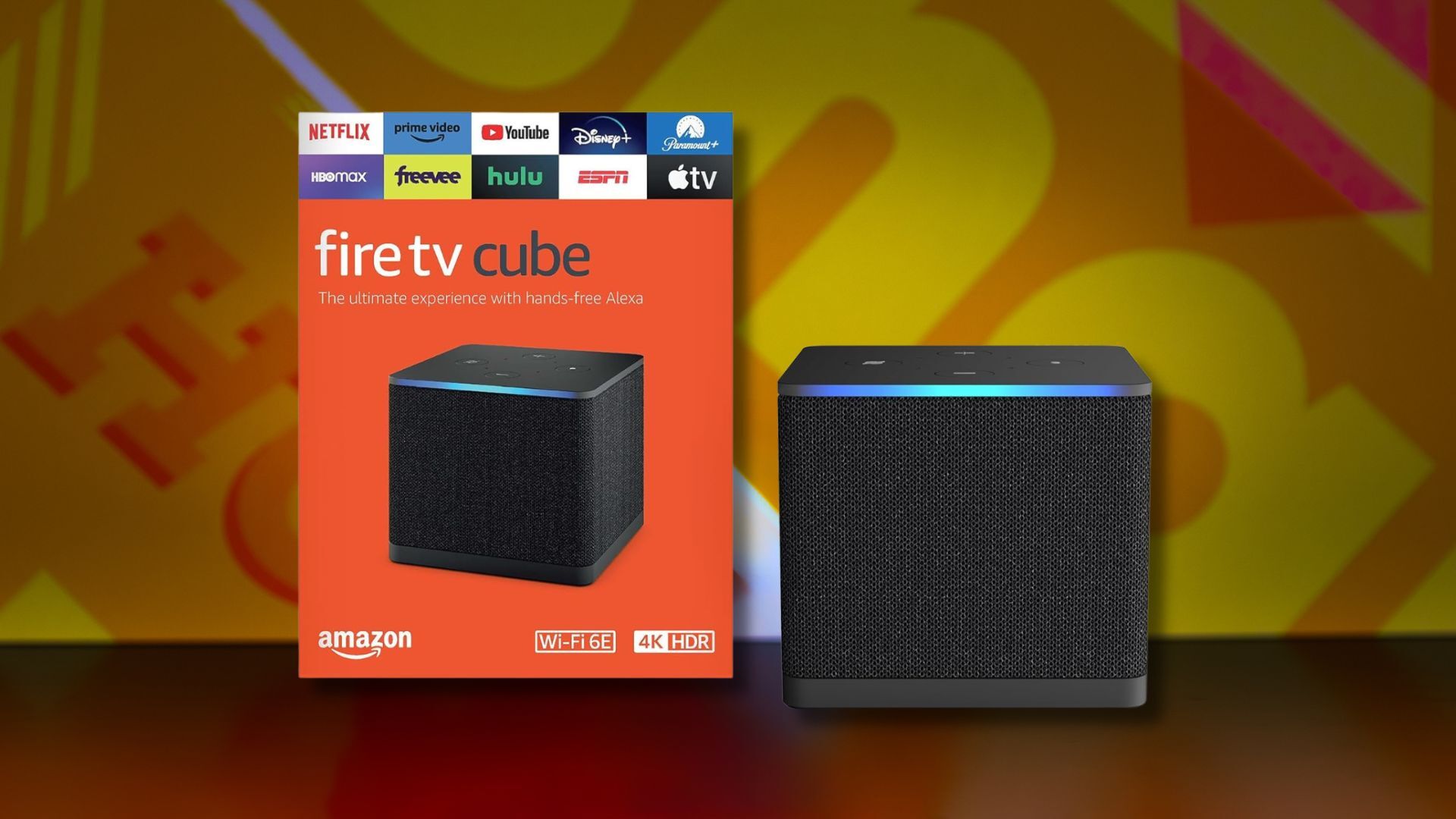 fire tv cube and box against a dark yellow patterned background