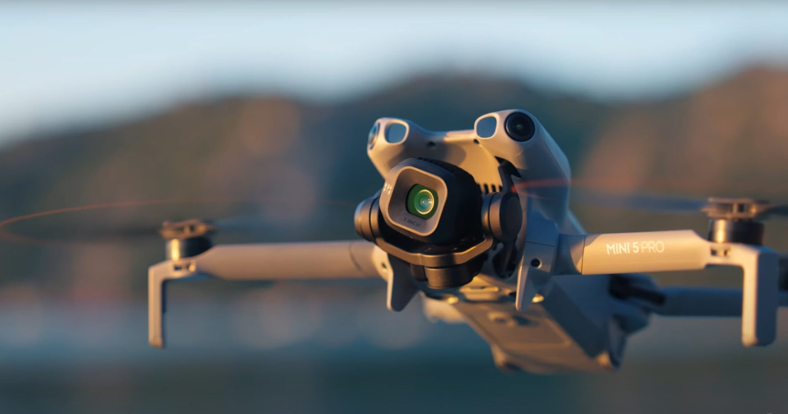 the DJI mini 5 pro drone hovers in the air during sunset light